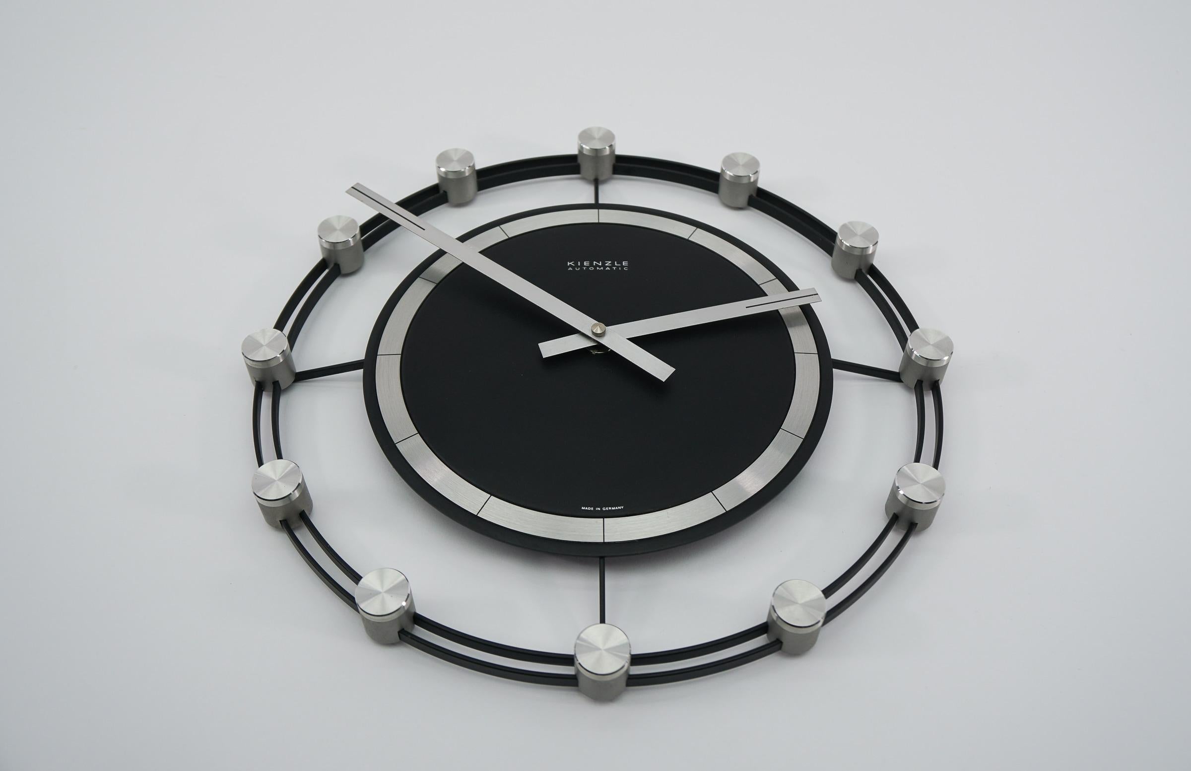 Stunning sunburst wall clock made of aluminium and metal. 

One of the most beautiful models I have seen to date.

An eye catcher par excellence.

Made in Germany.

Electric, battery operated clock.