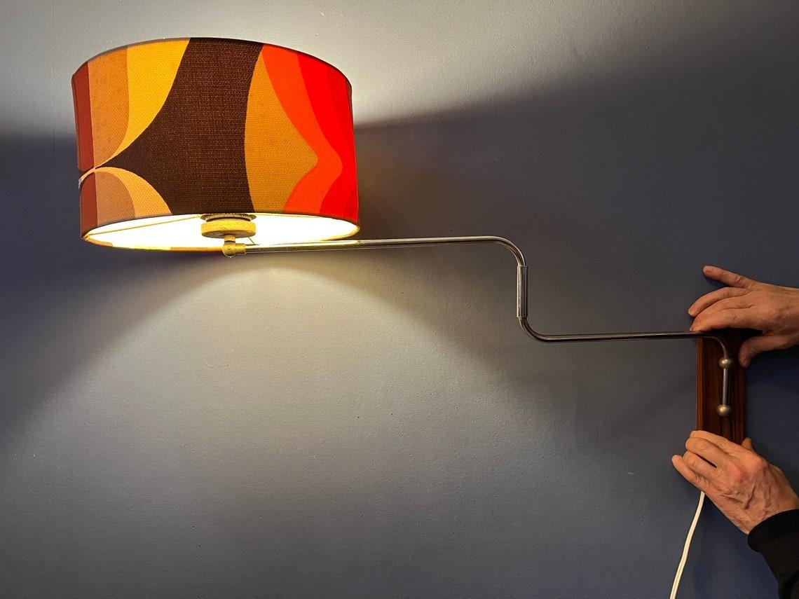 Fabric Space Age Swing-Arm Wall Lamp with Orange Flower Shade, 1970s For Sale