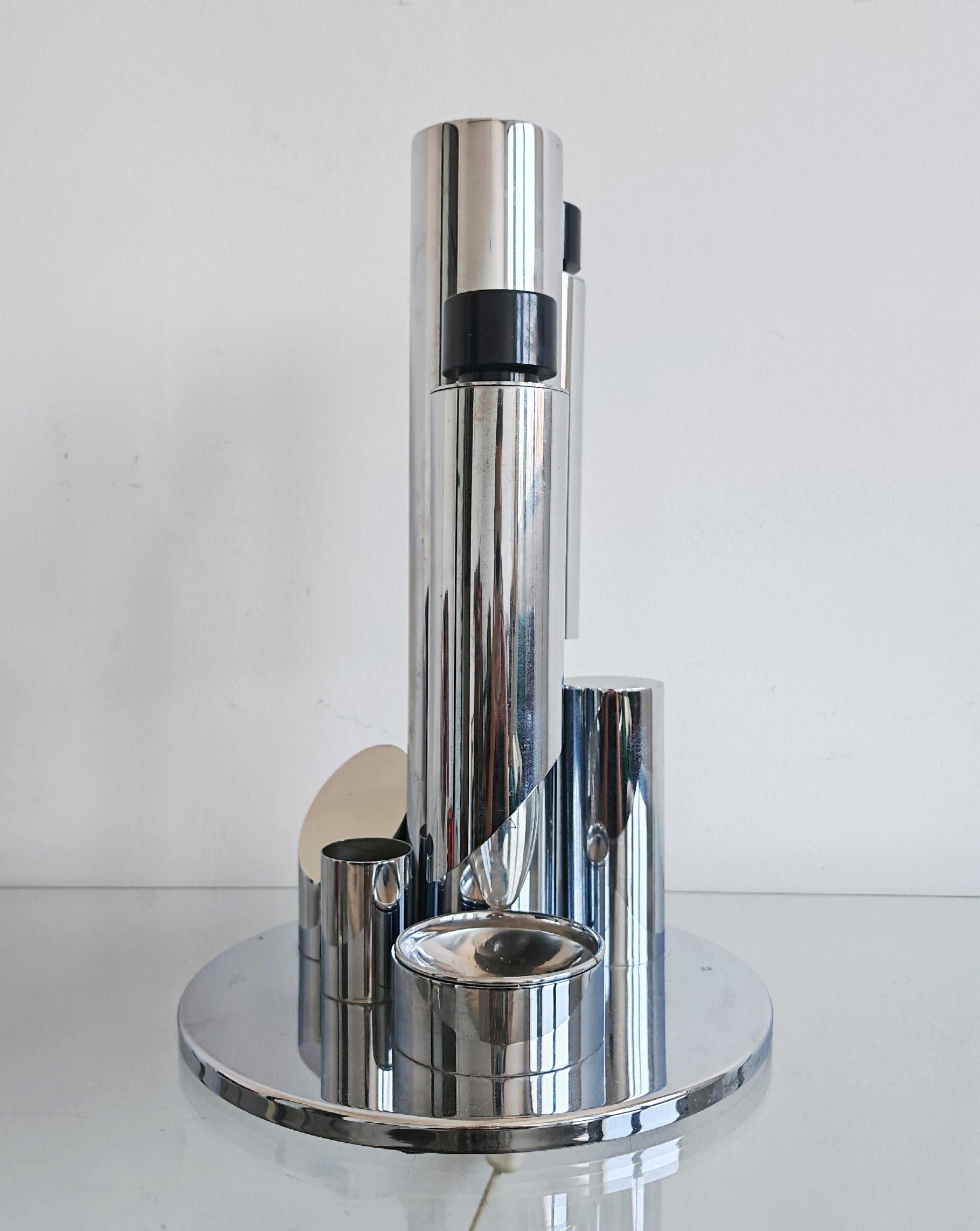 In this listing you will find a very rare Space Age desk lamp “Babilonia” by Fase. It features 2 adjustable light tubes, paperclip holder and pen holder. The lamp is functional and sleek, with dimmable lights. Made in Spain in the 1970s.

Lamp is in