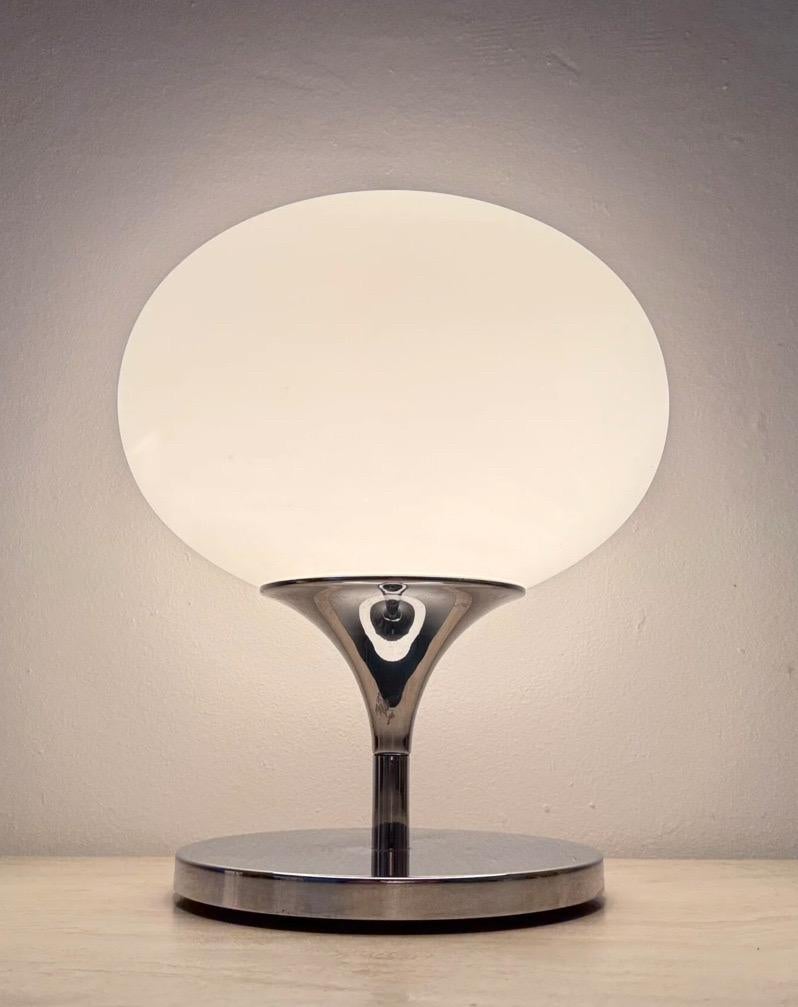 Opaline glass, chromed steel and casted iron table lamp by Kaiser Leuchten, circa 1970.