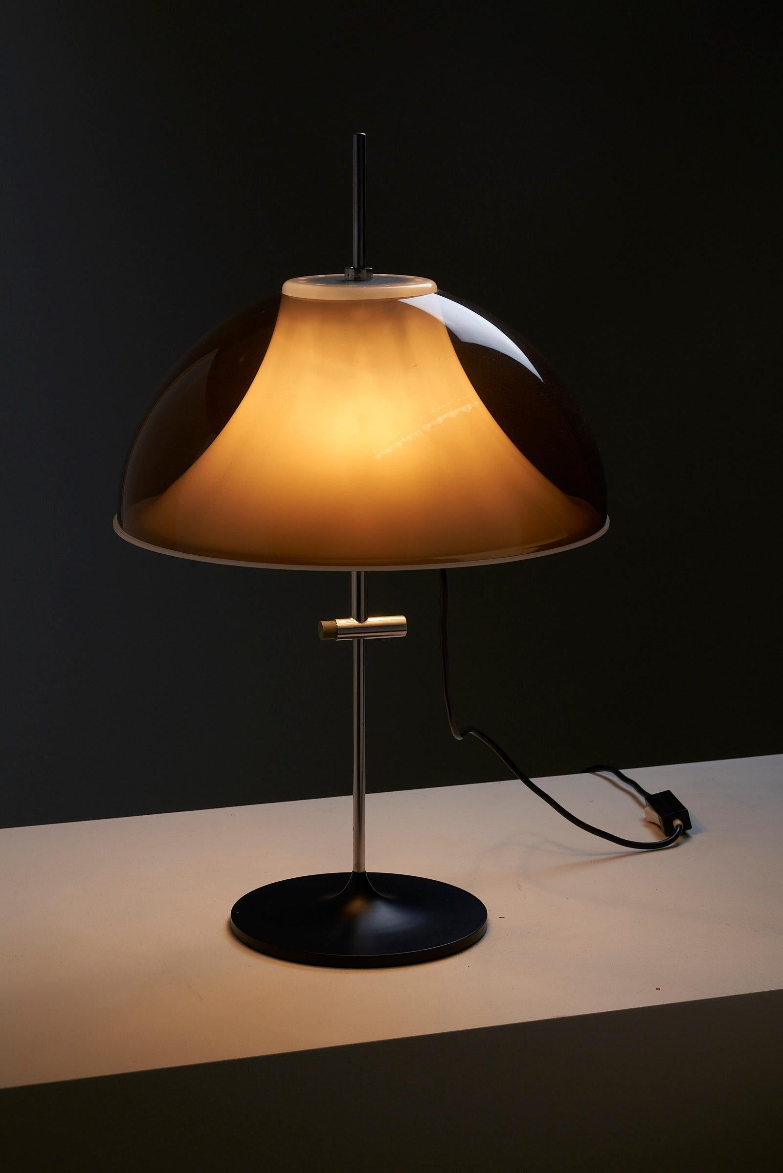 Transport yourself back to the iconic midcentury period with this extraordinary table lamp that embraces the captivating aesthetics of the Space Age style. With its distinctive design elements, it captures the essence of the era's futuristic