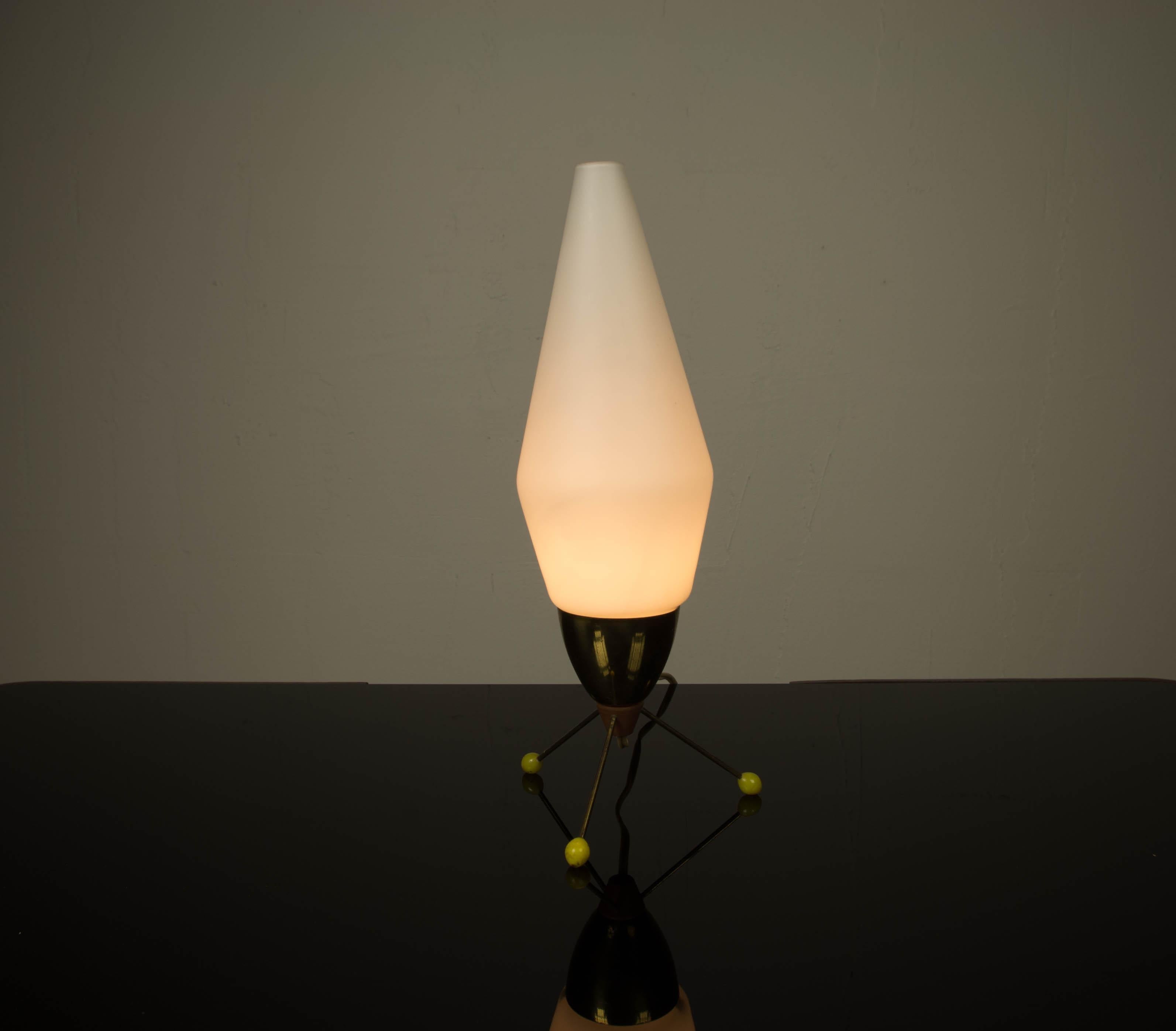 Brass base on three legs with plastic balls on the ends and with opaline glass shade, fitted with one E14 socket.
Designed by Stanislav Kucera in the 1960s for 