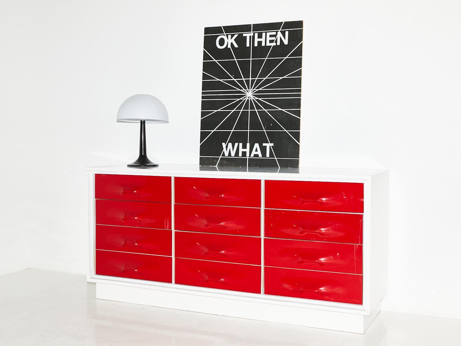 With its vibrant red color and sleek space-age design, this dresser designed by Giovanni Maur for Treco brings a retro-futuristic flair to any interior, making a statement that is out of this world.

Giovanni Maur is a visionary furniture designer