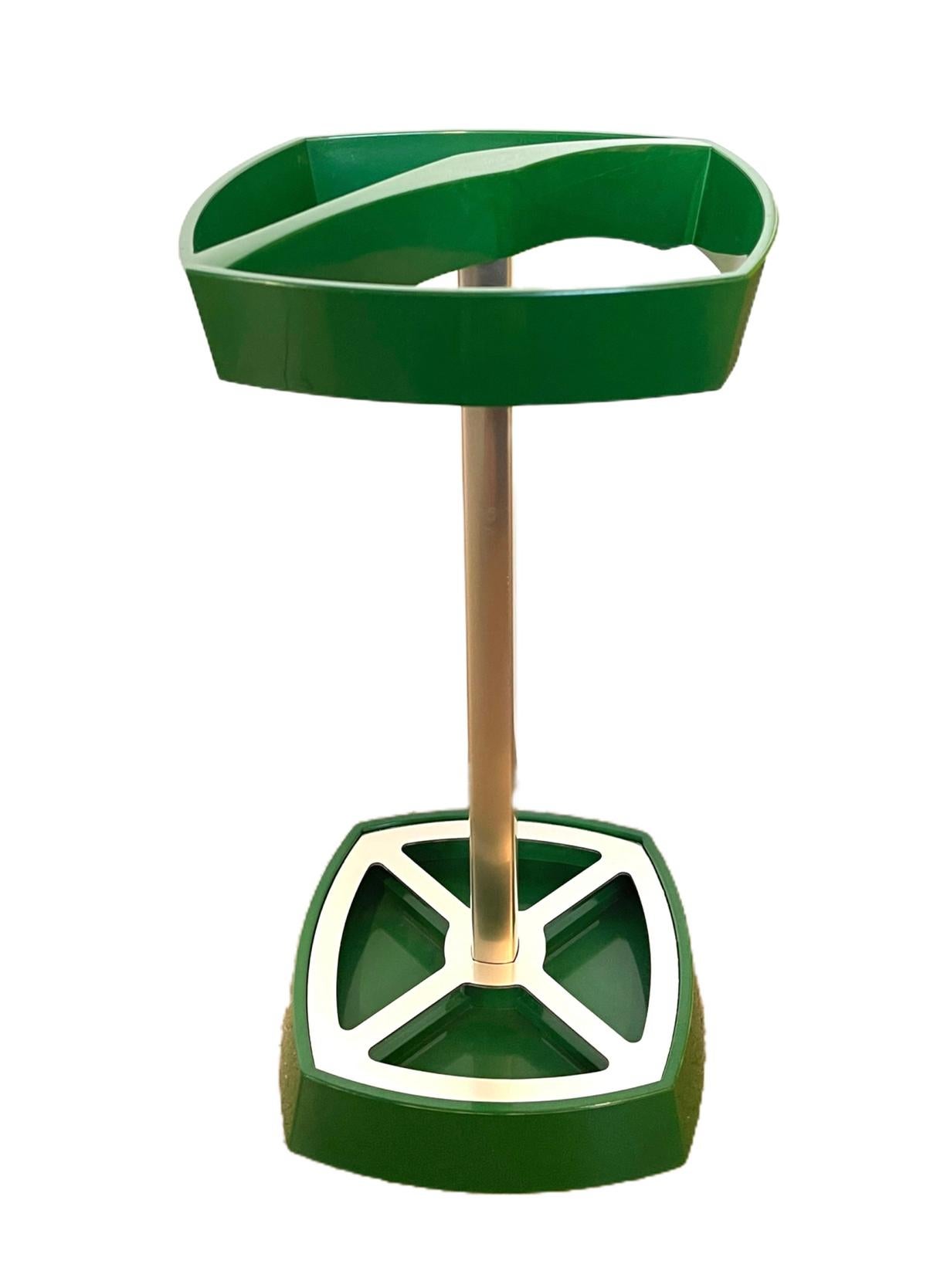 This space age green vintage umbrella stand was designed and made circa 1970. The umbrella stand features angular, futuristic details. Very good condition with some signs of age.