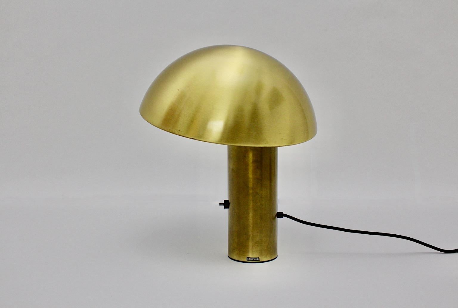 Space Age vintage brass mushroom like table lamp by Franco Mirenzi for
Valenti Luce 1979 Italy.
The model Vaga from brass and white metal shows dimmable feature, an on/off switch and one E 27 socket.
Labeled on the base with name Design