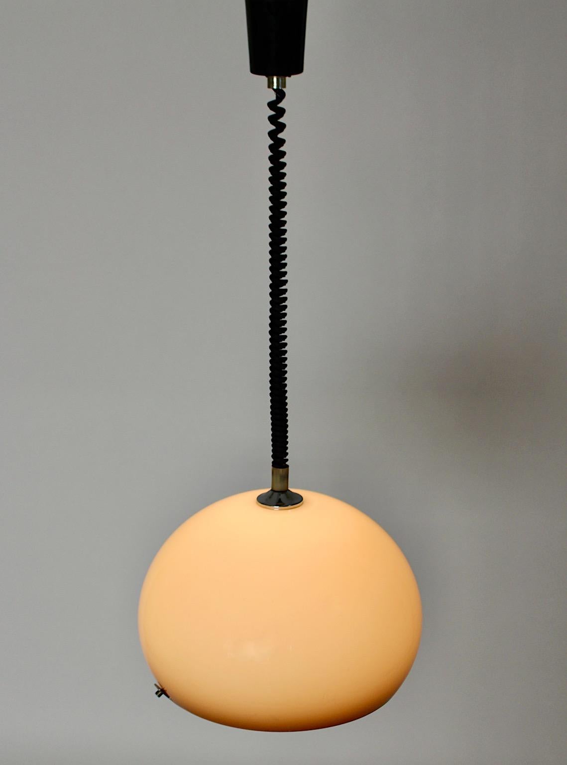 Space Age vintage chandelier or pendant from plastic and metal in soft brown hues 1960s Italy.
An amazing vintage chandelier in bubble shape in soft pastel brown color hues with a black curled extendable cable, so the height is from 80 cm to 135