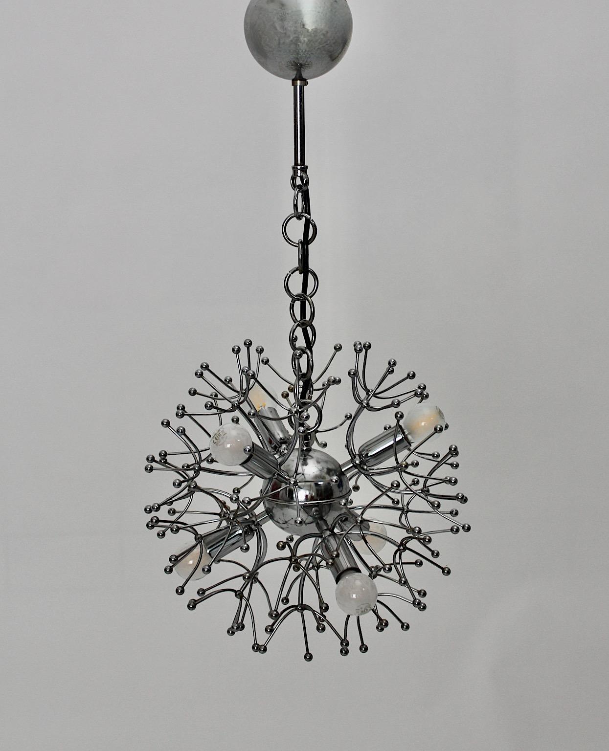 Space Age Vintage circular silver chromed sputnik shape pendant or
hanging light by Gaetano Sciolari 1960s Italy.
An amazing sputnik shape circular pendant with six E 14 sockets from chrome plated metal in silver color.
This circular shaped