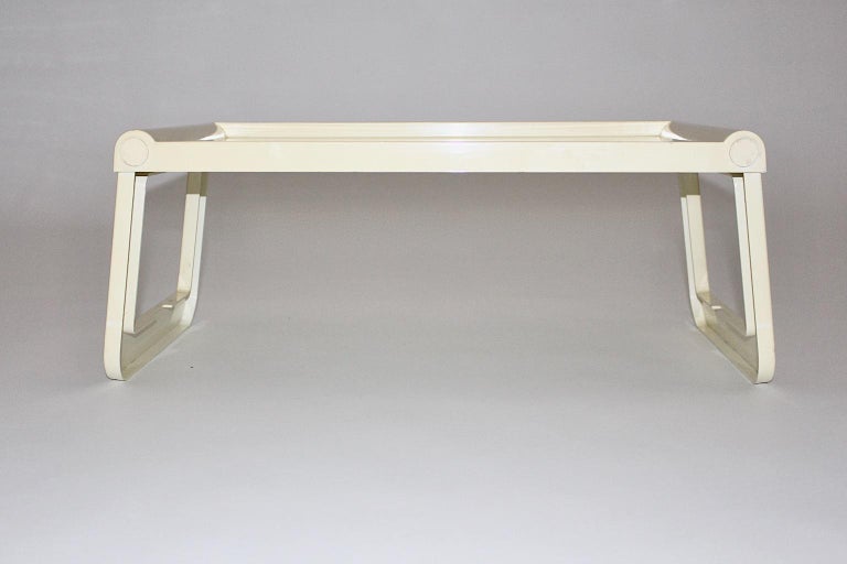 Space Age vintage ivory foldable tray or table from plastic designed by Luigi Massoni Grafico Studio Zeto for Guzzini 1970s Italy.
This foldable tray table is very useful as a breakfast table or a laptop table.
Executed in ABS plastic
Labeled with