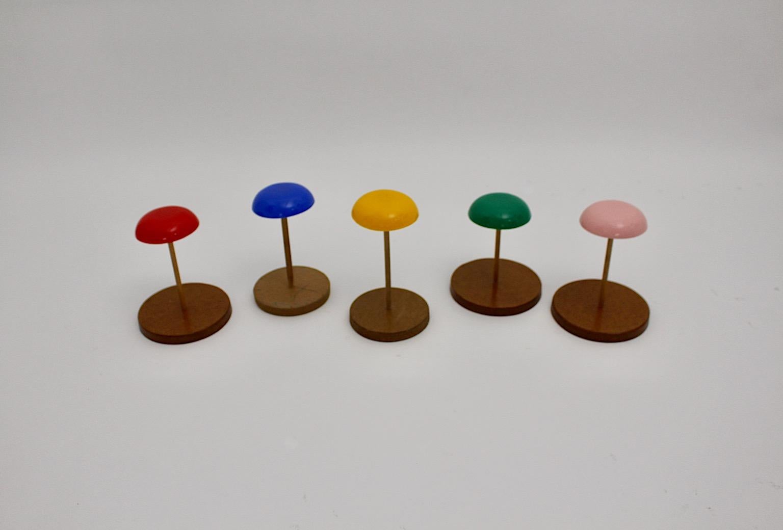 Space Age vintage hat stands or hat racks multicolored plastic and plywood 1960s Austra.
A stunning collection from multicolored bold hat stands in colorful variants.
While the hat shows colorful plastic, the stem and the circular base was made