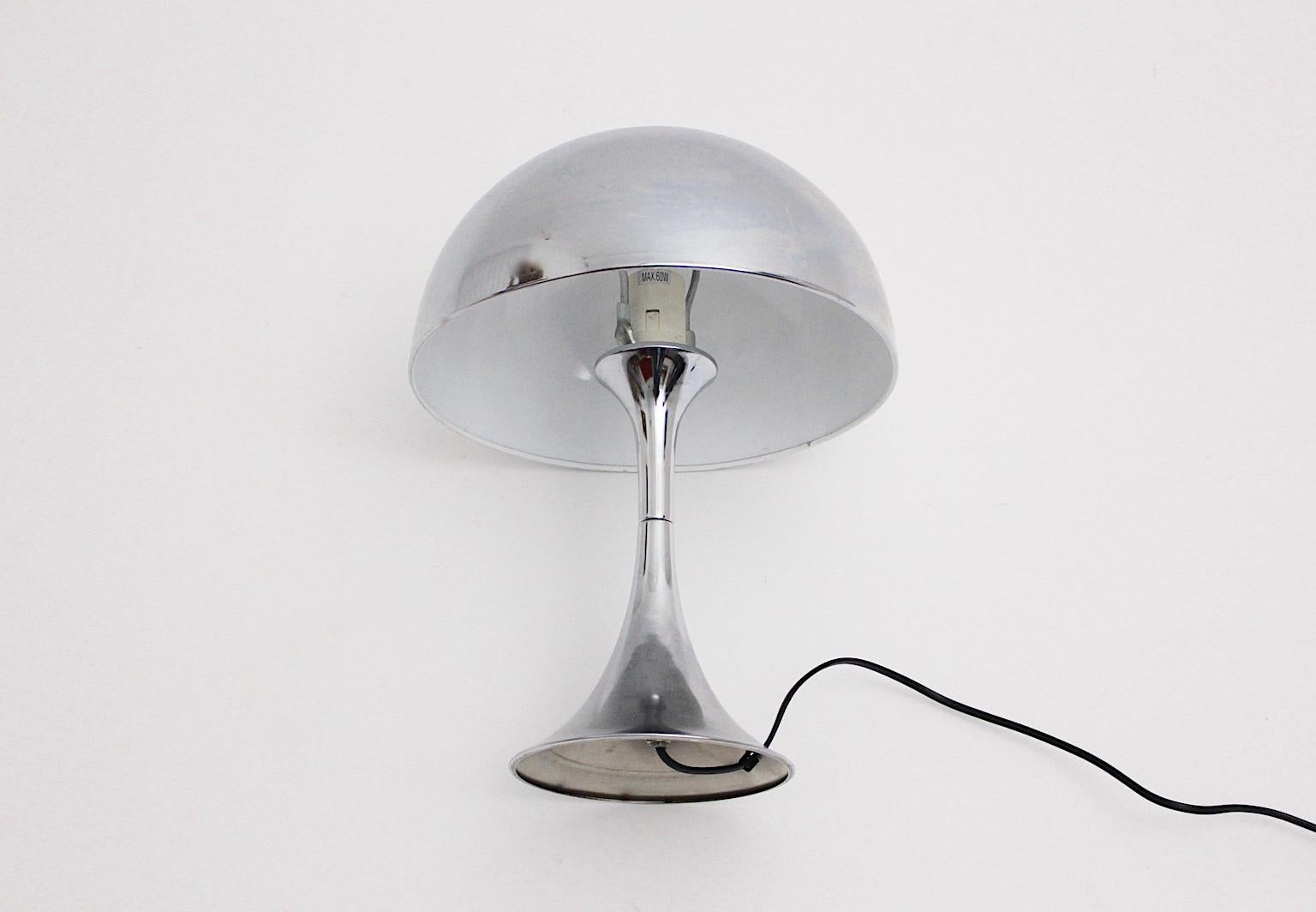 A Space Age vintage trumpet table lamp, which was designed in the style of Goffredo Reggiani, circa 1970.
The table lamp shows trumpet shape, while the metal base and shade were chromed.
The vintage condition is very good with minor signs of