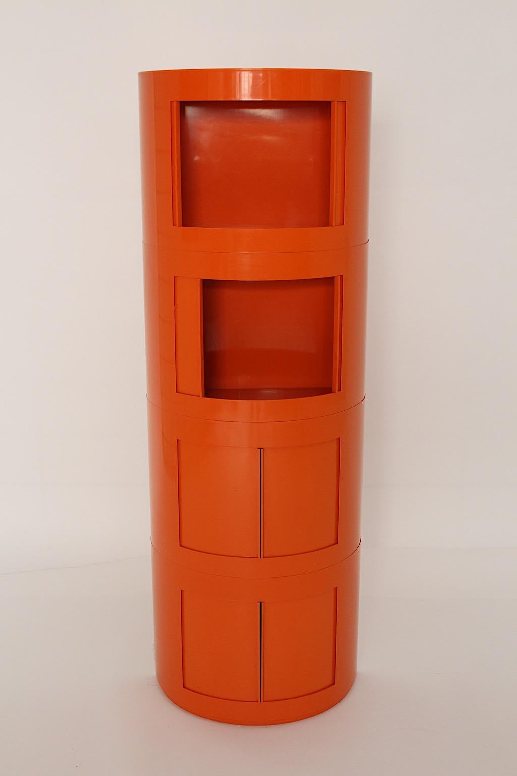Soace Age vintage orange commodes or chest of drawers Storage container from plastic Depositato Model Packo designed by Giorgina Castiglioni for the company Bilumen, 1960s, Italy.
It shows stackable parts and sliding doors, which create a beautiful