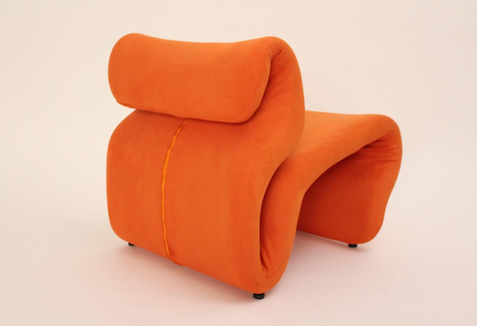 Space Age vintage sculptural iconic orange etcetera chair or lounge chair by Jan Ekselius designed 1970s Sweden.
The chair is reupholstered and covered with orange textile stretch fabric, backside with a zip. 
Black plastic feet
Good condition with