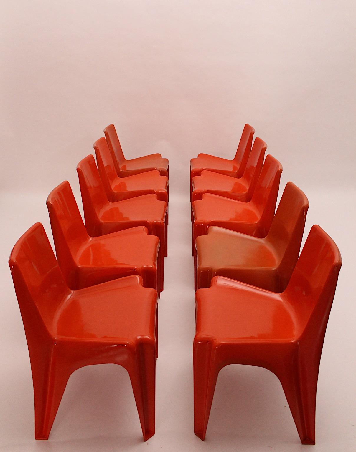 Space Age vintage ten dining chairs or chairs from plastic in cherry red color tone by Helmut Baetzner Bofinger 1964 Germany.
The chairs are stamped underneath and are presented in a rare set of ten chairs.
All chairs are stable and sturdy.
These