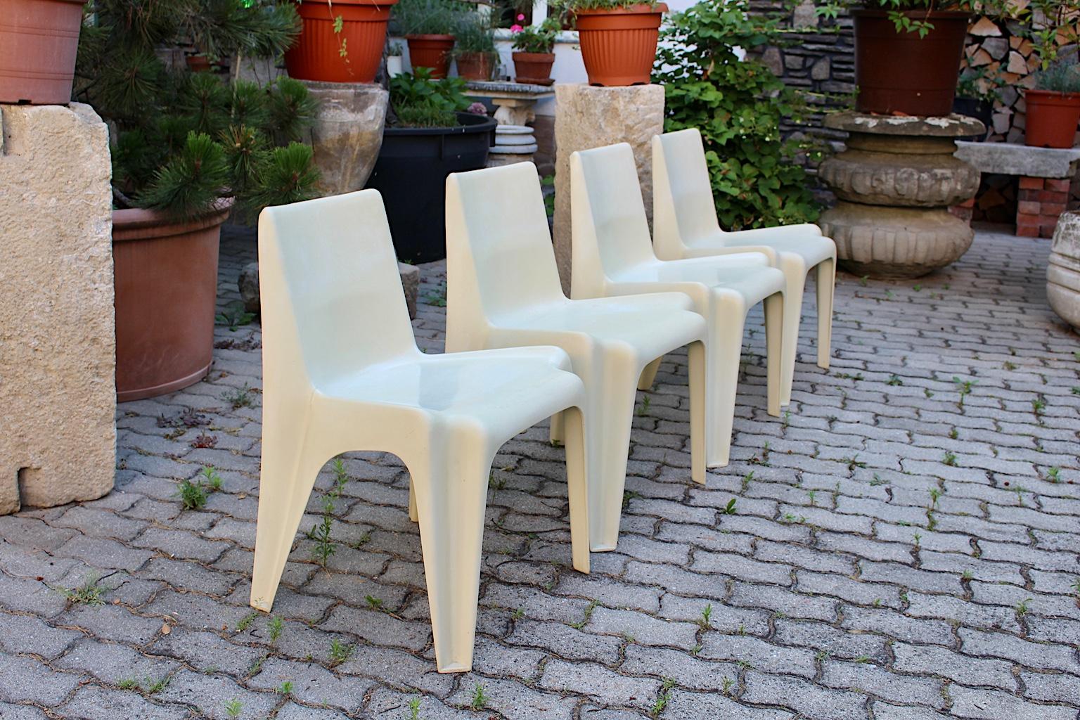 Space Age four white vintage dining chairs from plastic model No. BA 1171 by Helmut Bätzner for Menzolit Werke, 1966-1984.
A wonderful set of four dining chairs or chairs from plastic in light ivory 
color tone. 
The comfortable dining chairs would