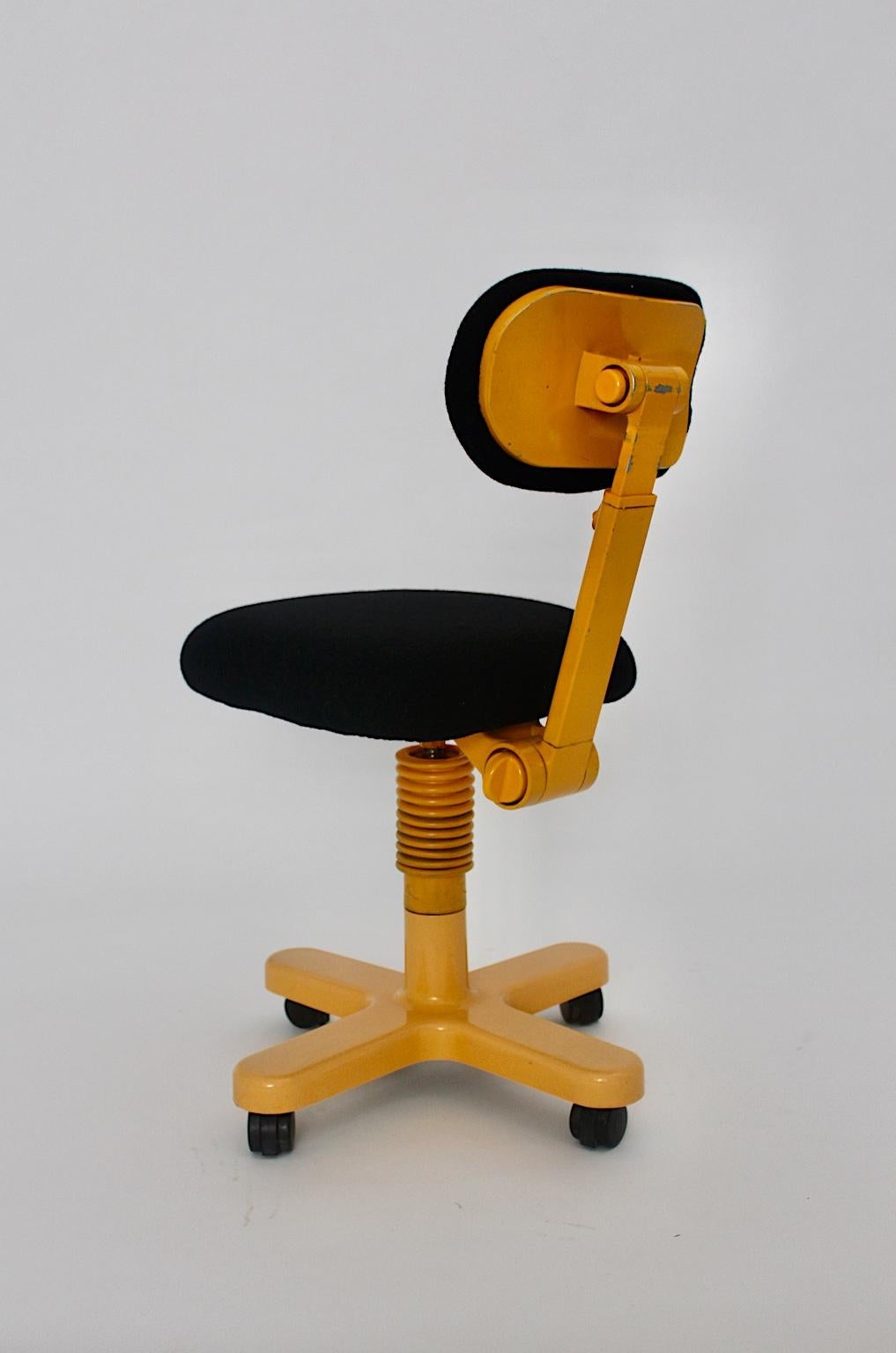 Space Age vintage yellow and black desk chair or office chair Synthesis designed by Ettore Sottsass for Olivetti 1968 Italy.
Ettore Sottsass designed in this time office equipments for Olivetti. He loved to integrate pops of colors into office