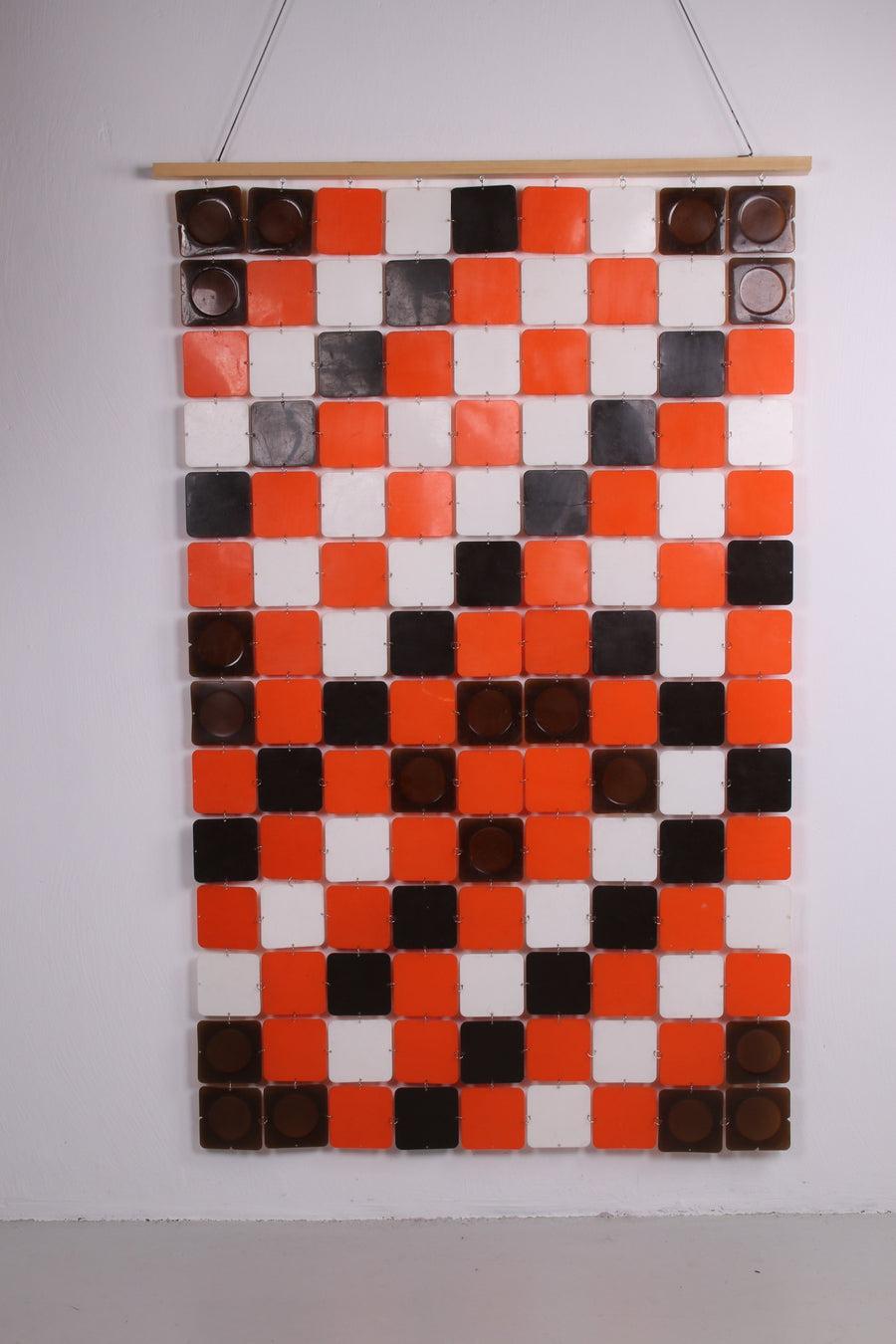 Space Age Wall Decoration or Roomdivider, 1960s

This is a beautiful vintage wall decoration made of plastic with the real colors (orange, brown and white) from the 60s.

The rings have been completely renewed. This can of course be used in