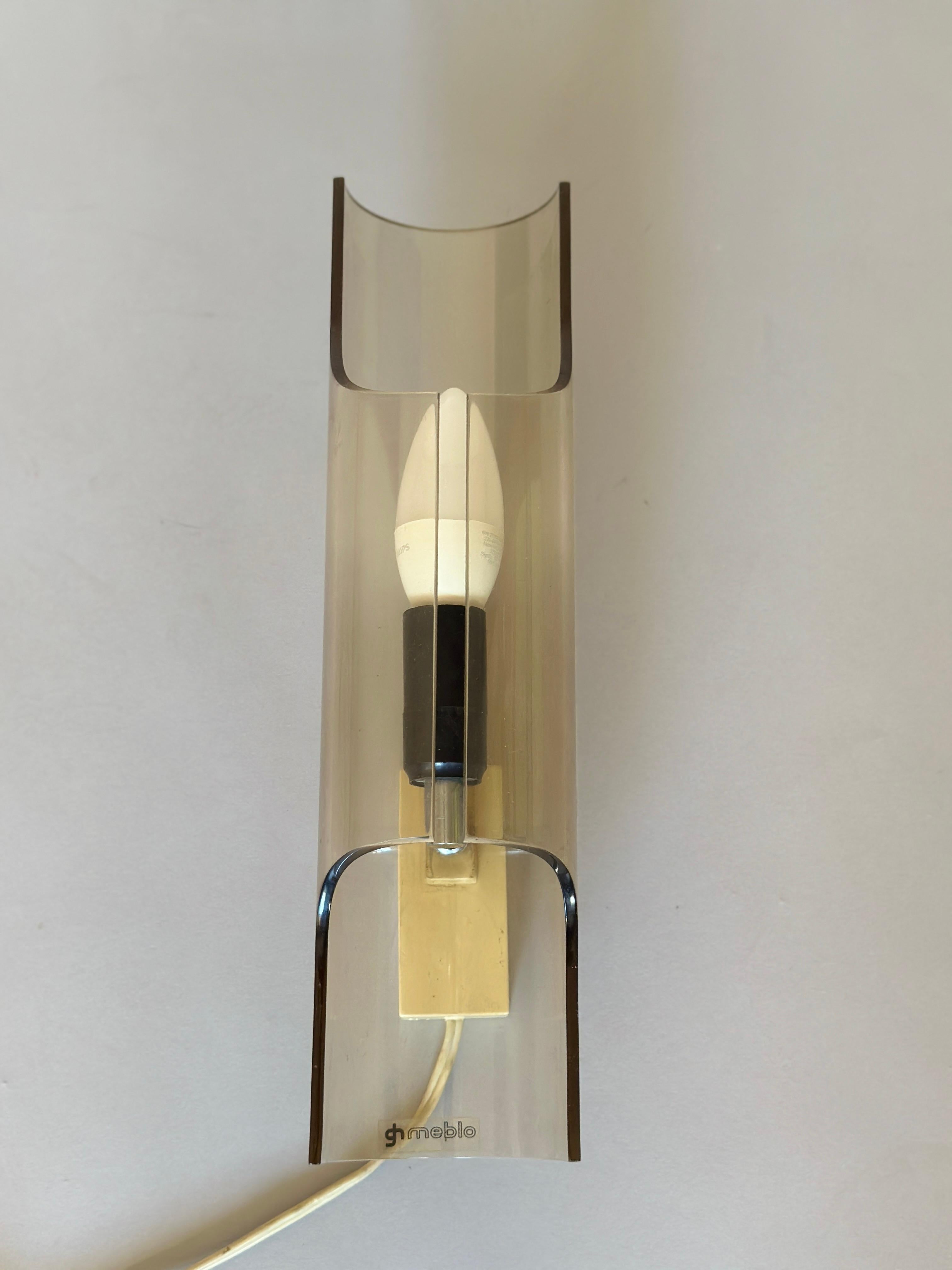 Amazing space age plastic wall lamp made by Meblo in the 1970s Yugoslavia. It was part of the famous Harvey Guzzini colection. An italian company famous for its modern design