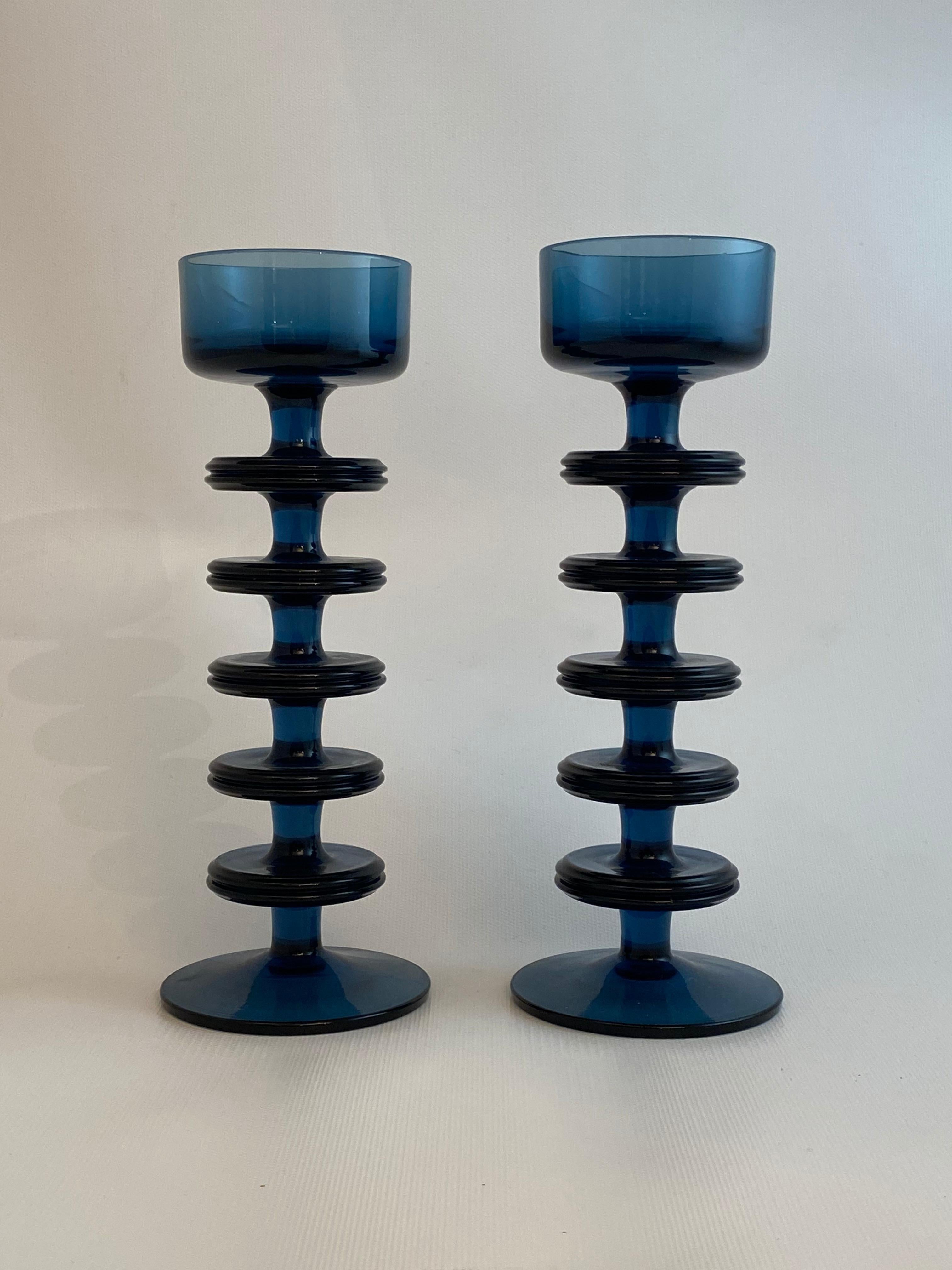 Fantastic pair of Wedgwood navy blue glass tiered candleholders. Acid marked on bottom, Wedgwood, England. This pair of candleholders would most likely hold a small tea light candle or round pillar style candle. Dark navy blue glass. Very good