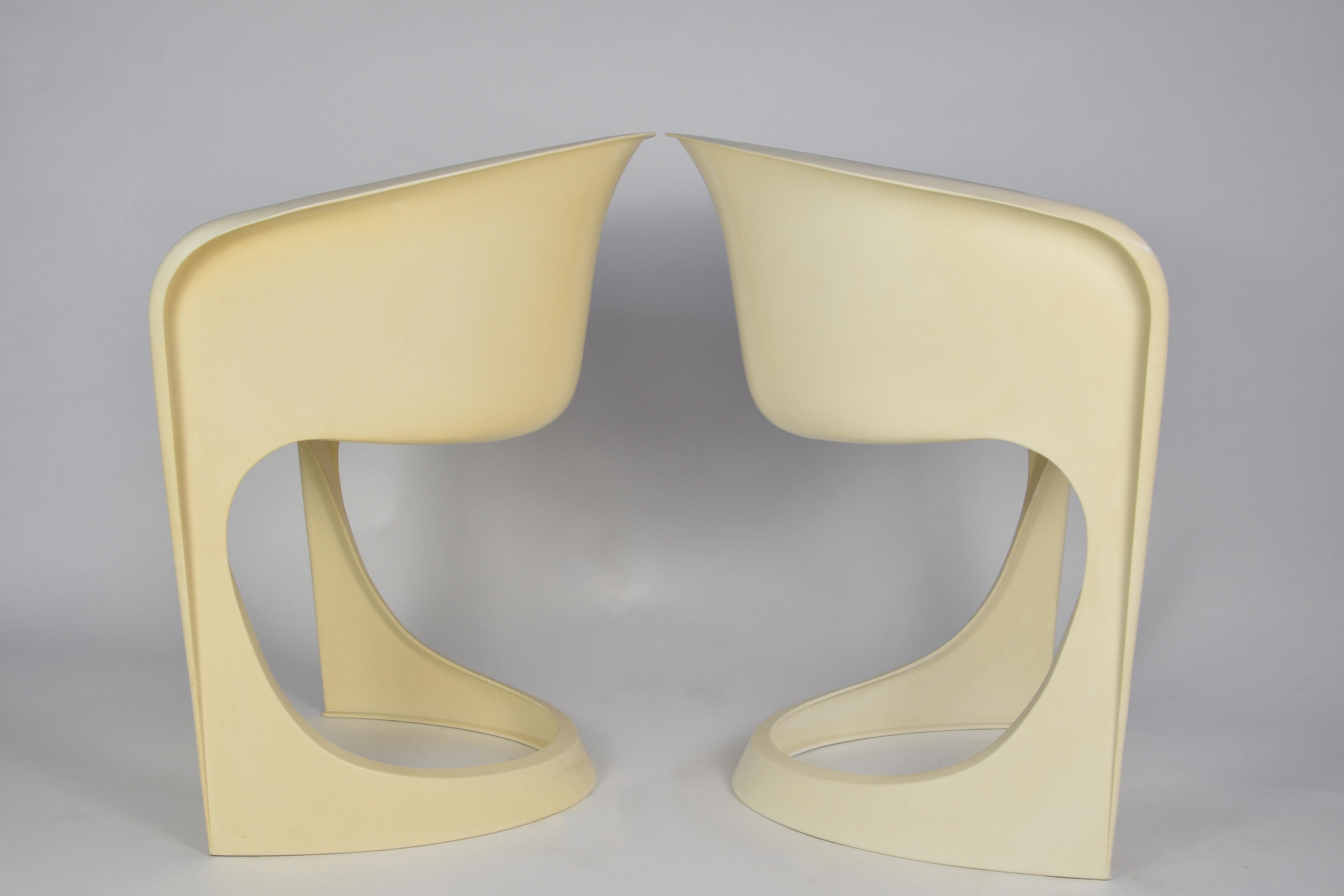Pair of white plastic chairs, designed by Steen Ostergaard from Cado in the 1970s.

Steen Ostergaard, Furniture designer, Inventor and Architect born in Denmark 1935, Nominated 