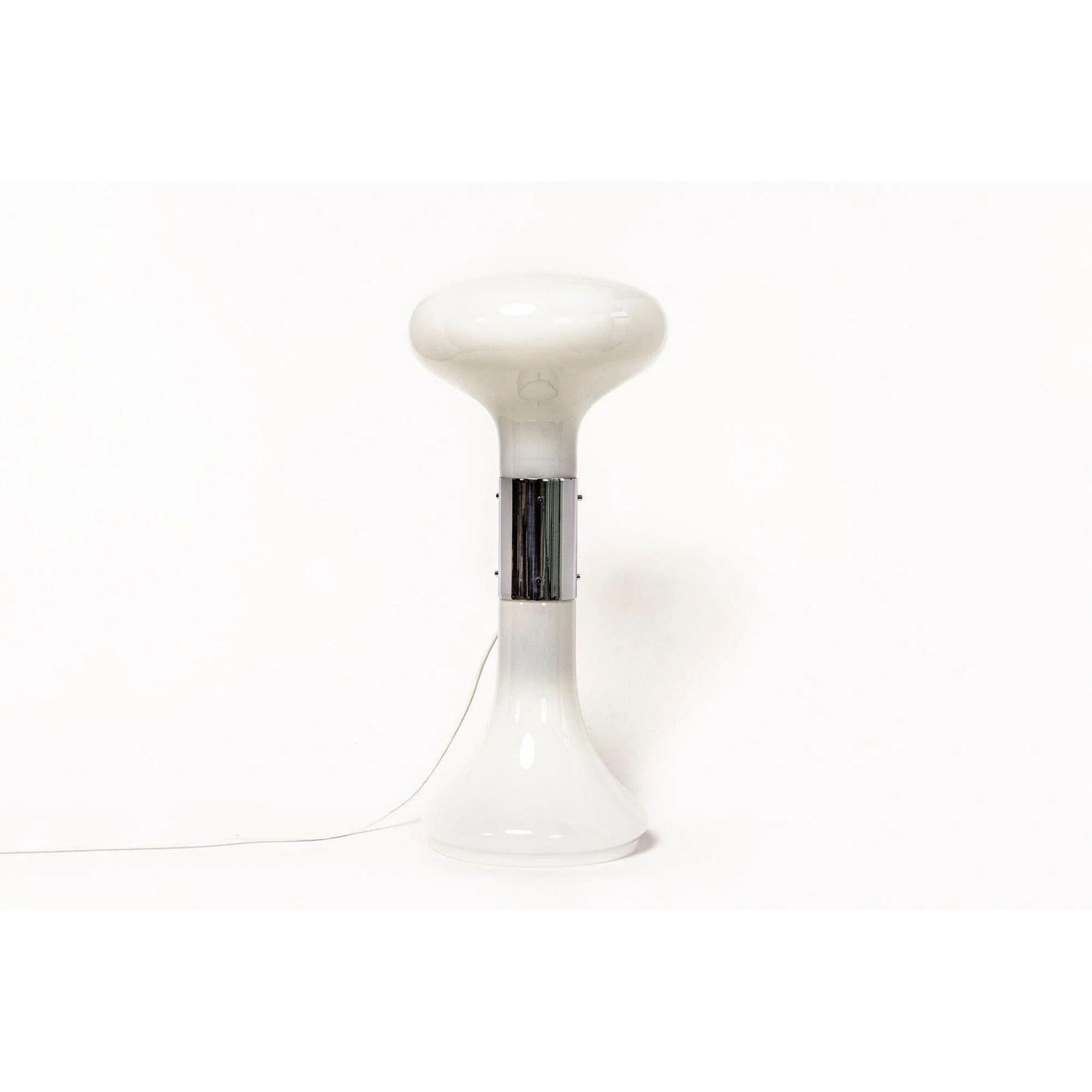 This stunning vintage Carlo Nason for A.V. Mazzega rare table lamp was made in Italy circa 1970. The Double Sided milk white hourglass-shaped lamp is made from hand blown Murano glass and is accented with a silver polished steel center band. This