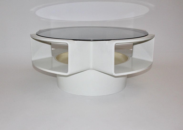 A Space Age white vintage plastic coffee table or sofa table, which was designed 1960s.
The Space Age coffee table was designed and manufactured during the era of the moon landing. In this period the people loved designs and interiors which was