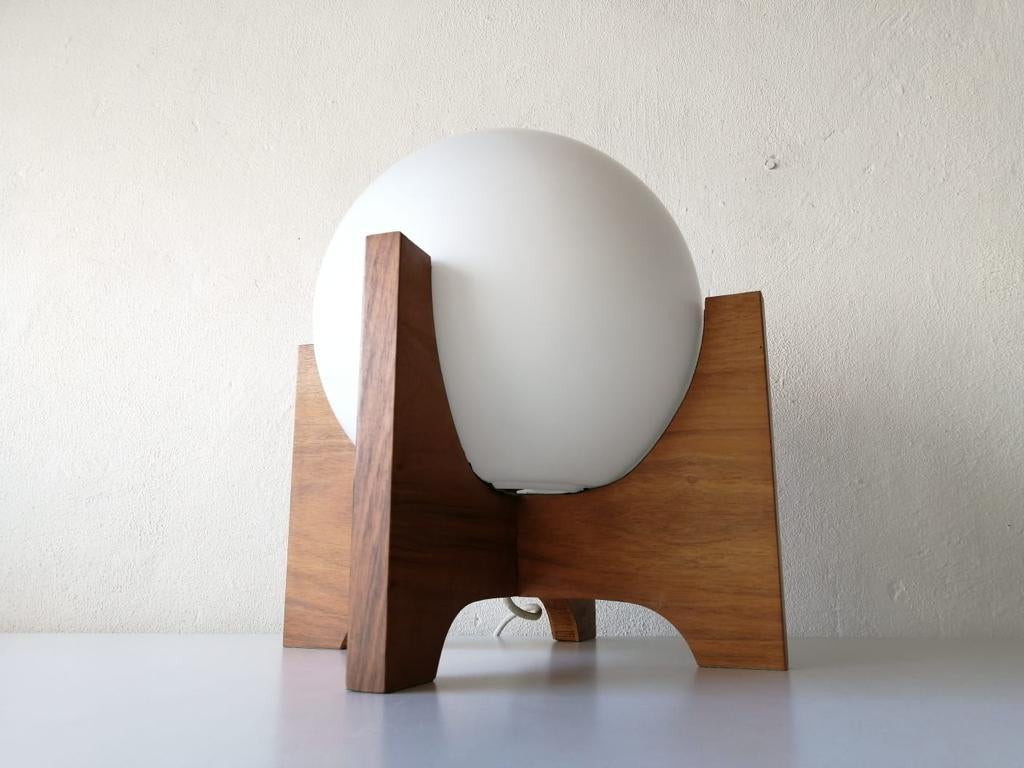 Space Age wood & ball opal glass table lamp by Temde, 1970s Germany

Minimal and very high quality design large table lamp.
Fully functional.

Original cable and plug. This lamp are suitable for EU plug socket. Switch on-off on the