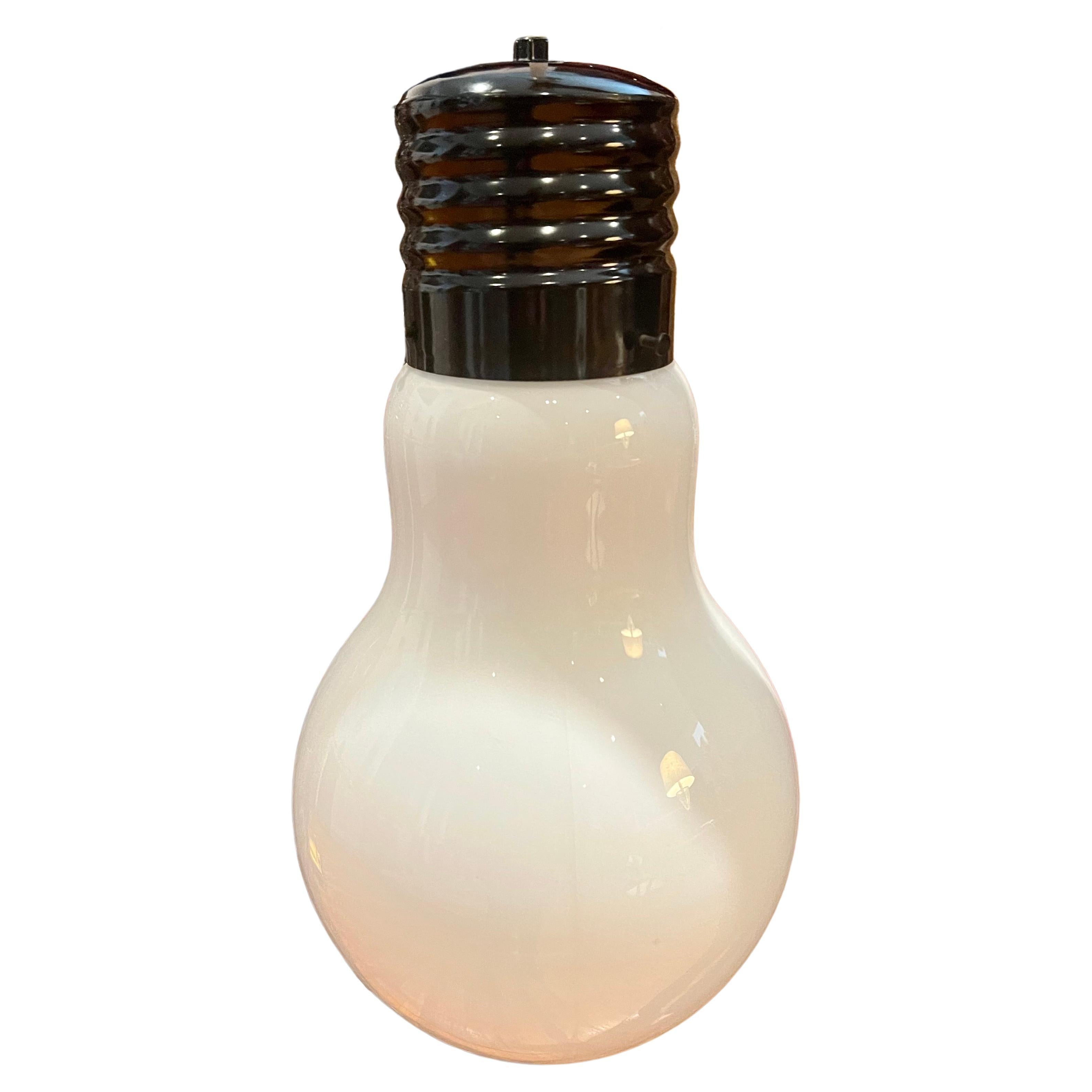 Striking large milk glass light bulb chandelier, in original condition with white plug-in cord and switch, excellent and working condition a very unique piece.