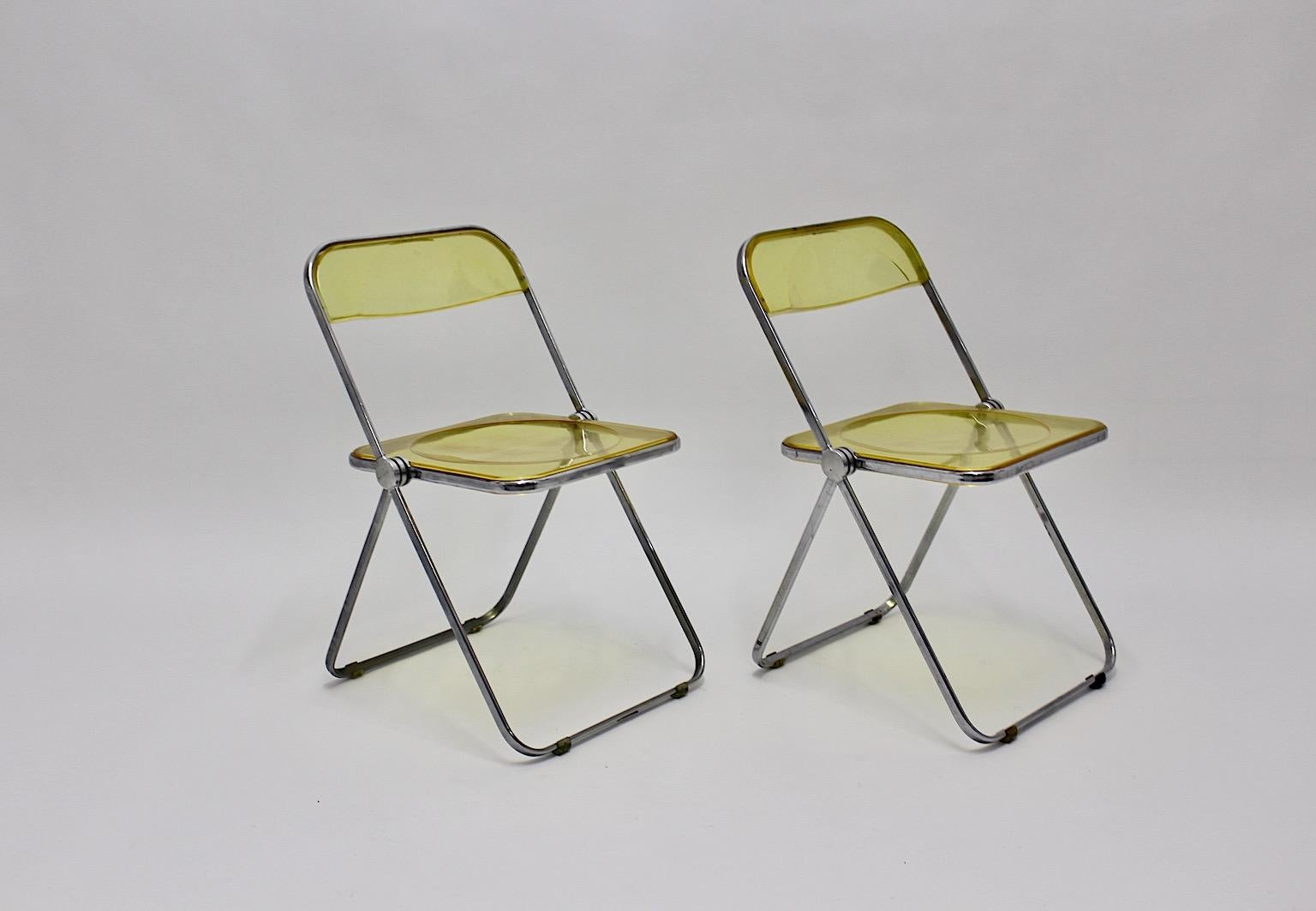 A Space Age yellow Lucite Plia pair of folding chairs designed by Giancarlo Piretti for Castelli 1969 Italy.
This foldable iconic chair is one of the most popular designs by Giancarlo Piretti, which was launched in 1967 in Milan. The Plia chair