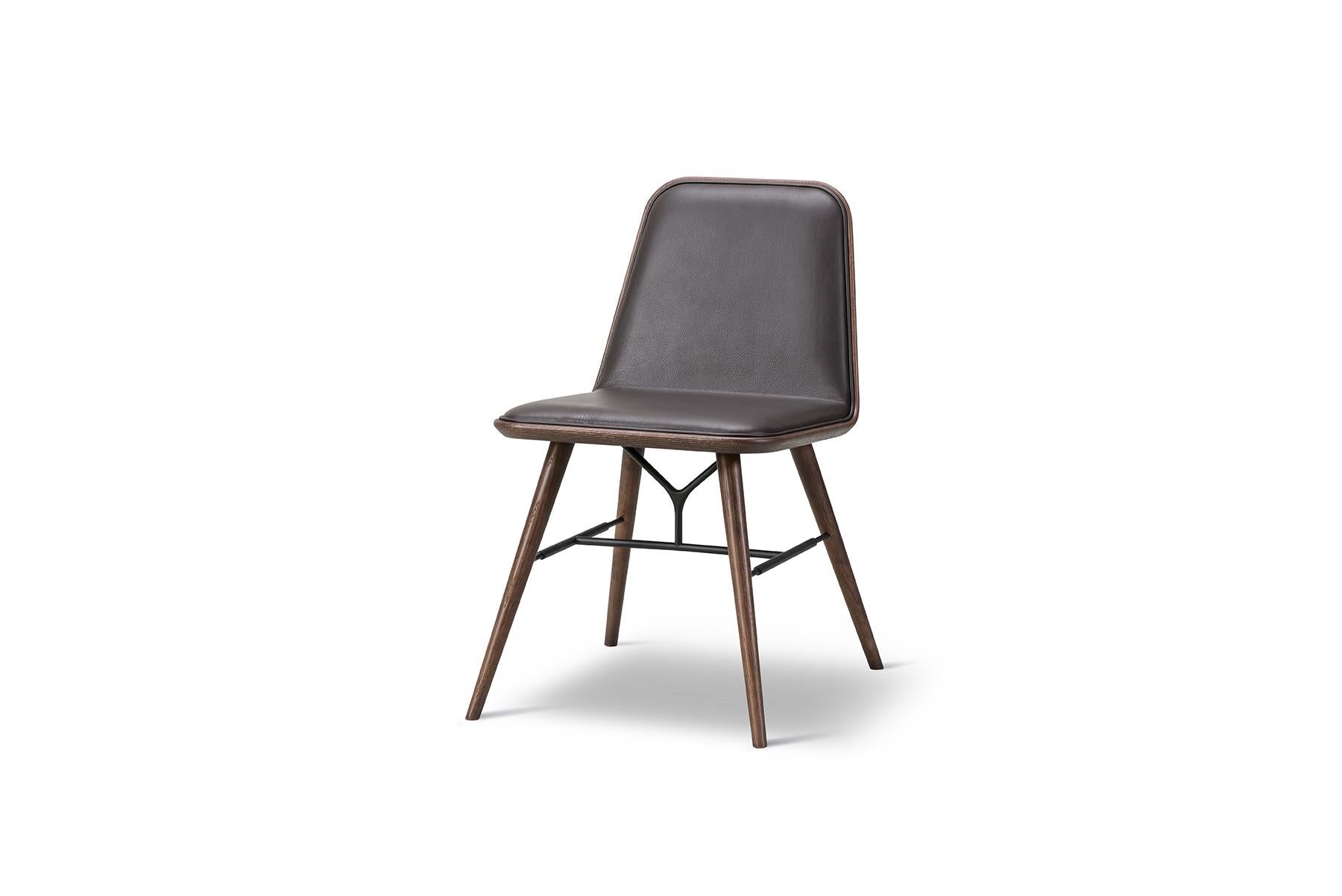 Space Copenhagen spine chair is the fusion of Fredericia’s craft traditions and Space Copenhagen’s dynamic visual language that uses both classic motifs and unorthodox details. Designed as a luxurious dining chair for both public space use and