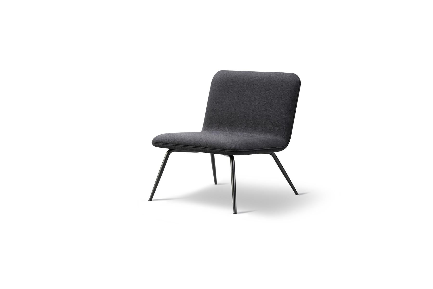 Space Copenhagen spine lounge chair is a light lounge chair for residential homes or open lounge areas. The accented detailing on the fully upholstered seat in either leather or fabric makes the chair as beautiful standing mid-room as it is against