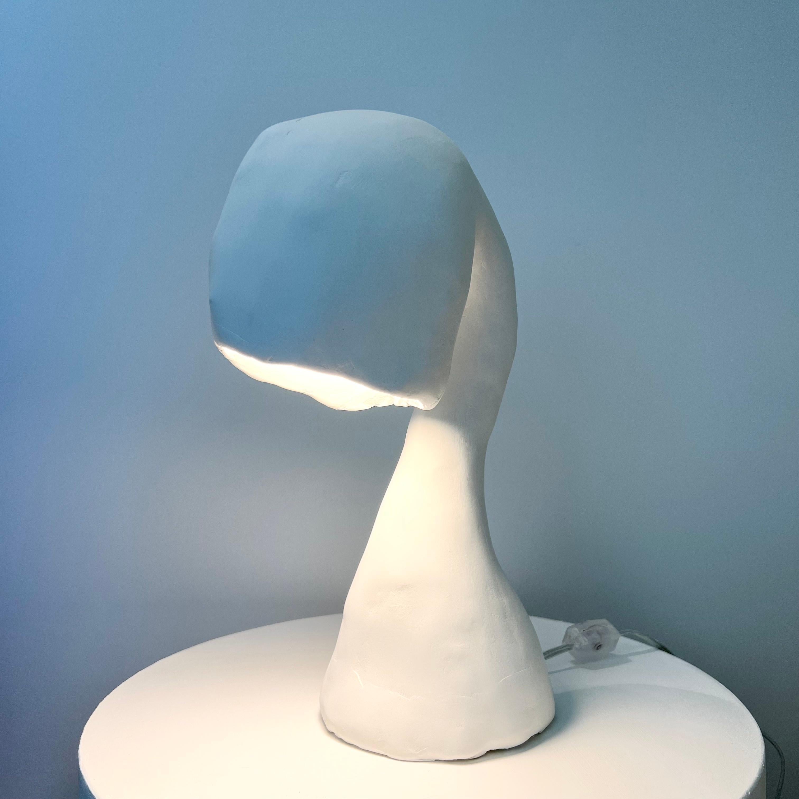 Designed by Studio Chora, Space Invader Mini, 2021.
Amorphous, nonconforming, the Space Invader is expressive of the human form. 

The Space Invader series of organic light sculptures are one-of-a-kind and hand moulded from a composite paper clay