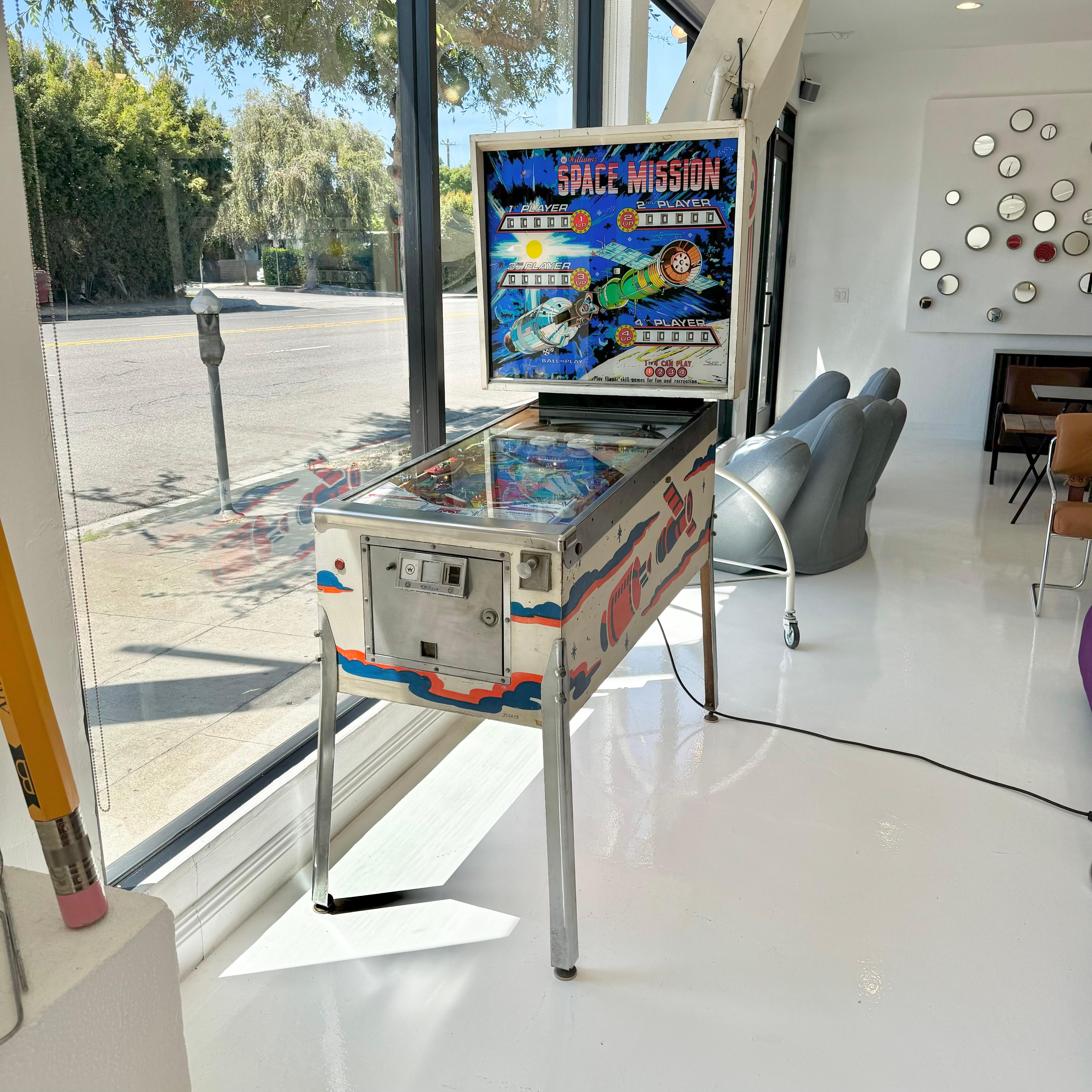 Vintage 'SPACE MISSION' pinball machine from 1976. 4 players can play. Made by Williams Electronics. In excellent working condition. Great visuals and sounds. Extremely fun paced gameplay. This game features kick out holes, moving target, swinging