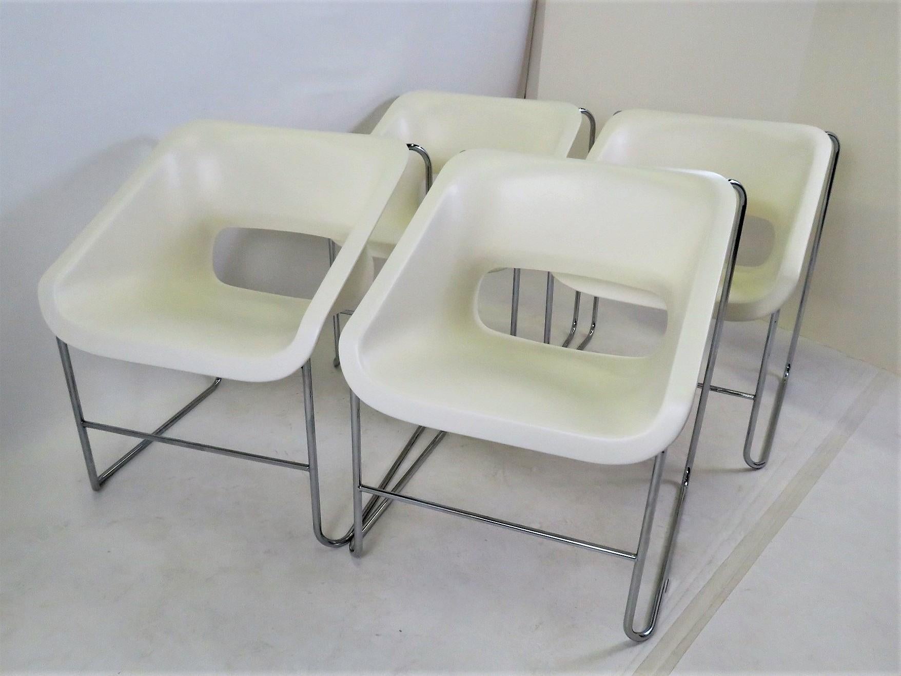 Set of 4 Space Age Mid-Century Modern armchairs created by Paul Boulva for the Montreal Olympics in 1976 and produced by Artopex of Canada. The chairs sport a chromed metal frame with molded plastic seat. They are stackable.
Stamped on bottom of
