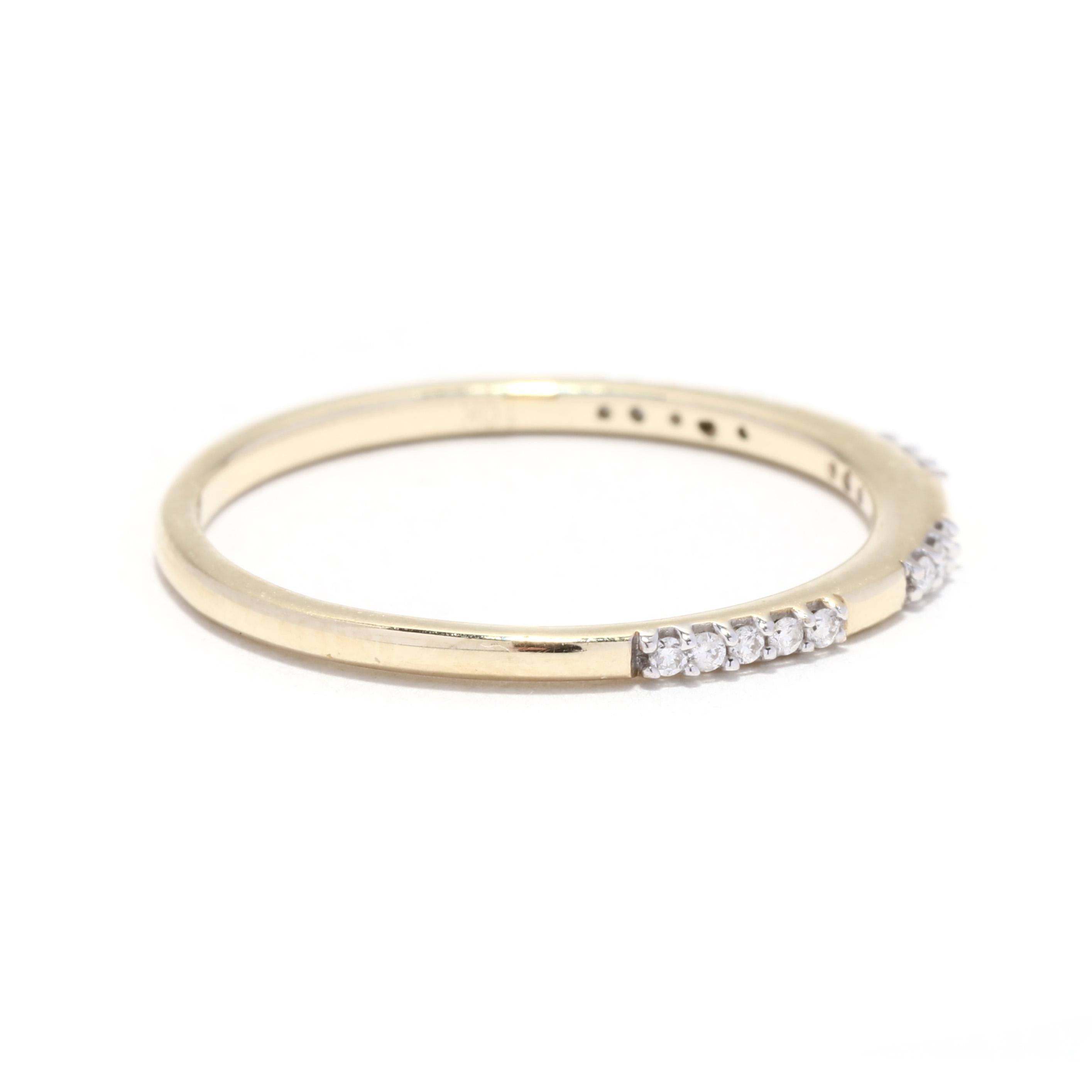 A 10 karat yellow gold spaced diamond wedding band. This stackable band features a thin design with spaced diamond set stations weighing approximately .08 total carats set in white gold.

Stones:
- diamonds, 16 stones
- round brilliant cut
- 1 mm
-
