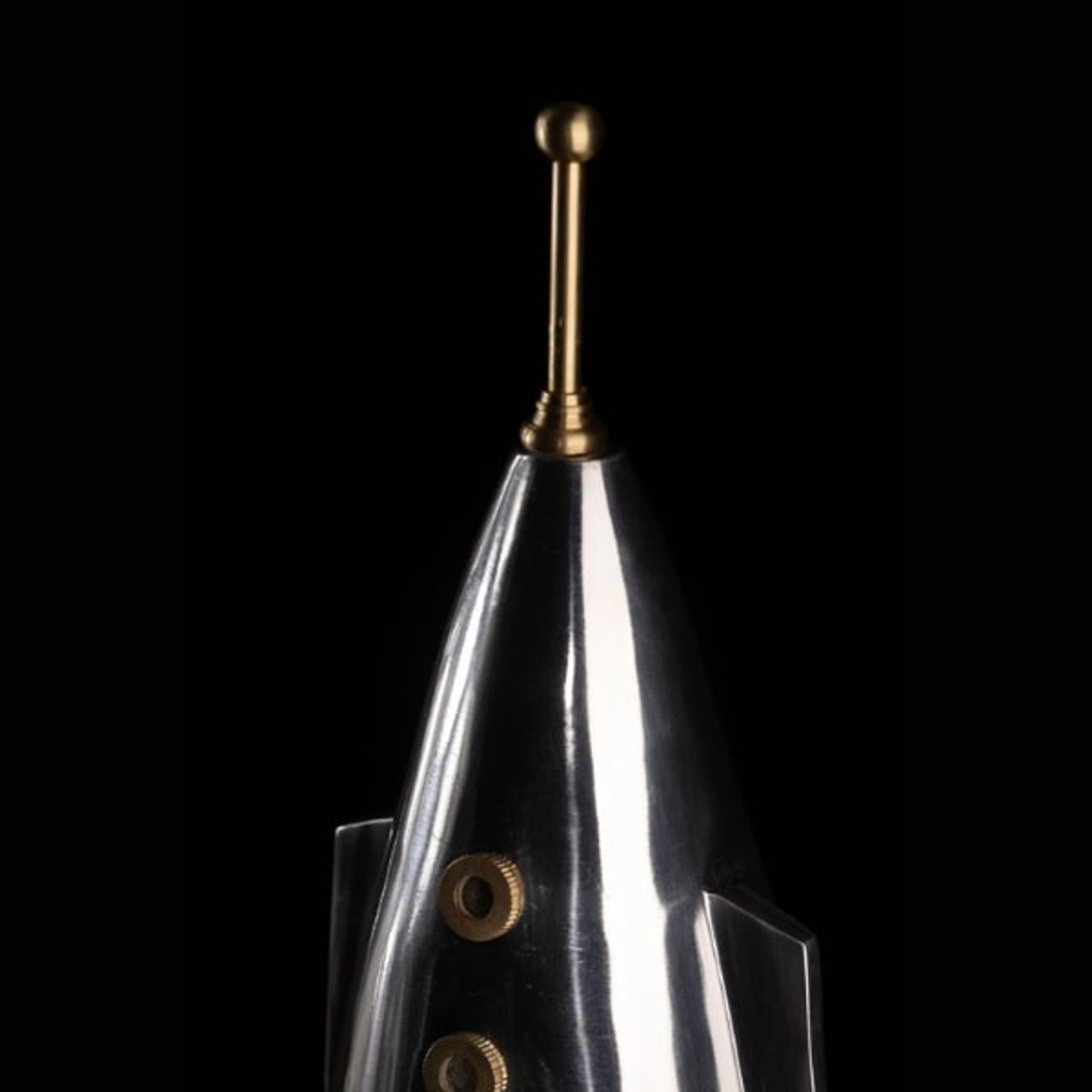 An icon from the birth of the space age, This Space X Rocket Clock houses a retro 1950s dial and hand amidst sleek lines of polished aluminum and brass. An homage to SPACE X FALCON 9 for its 87 launches completed. This retro futuristic display