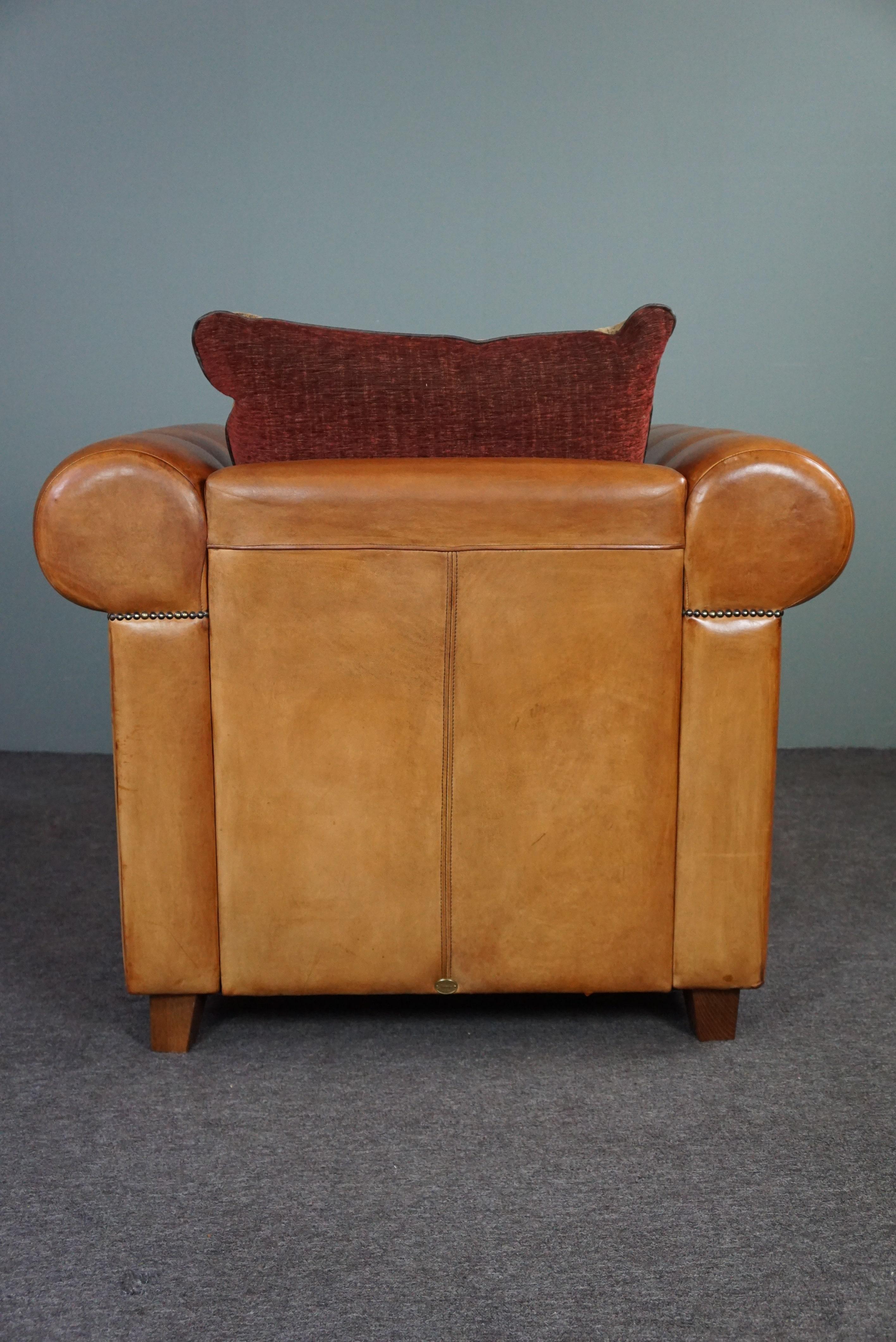 Hand-Crafted Spacious & very comfortable sheep leather armchair For Sale