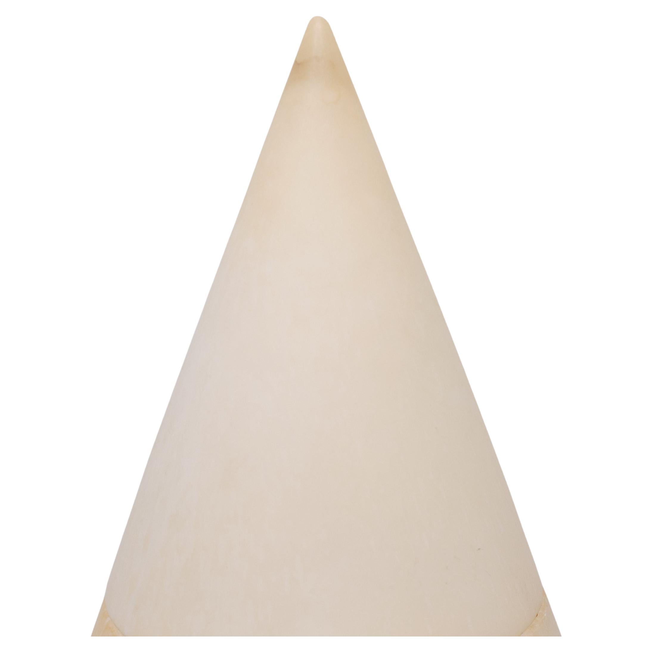 Very nice Cone shaped table lamp. Solid Alabaster. A nature stone.
Spain 1970s Lovely warm color when lid.