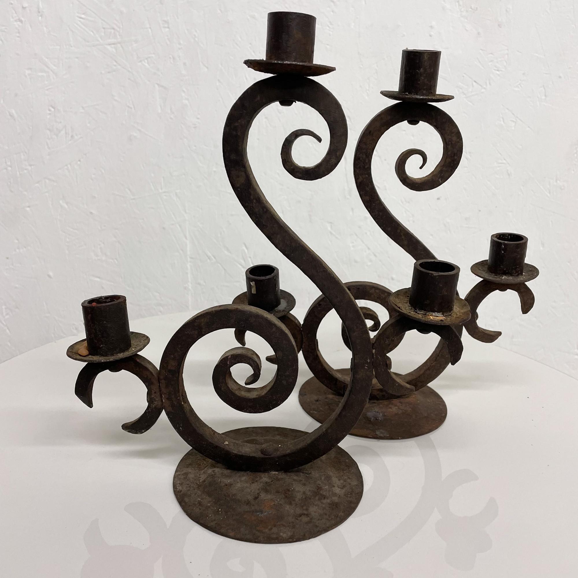 Patinated Spain Forged Iron Candelabra Pair + Three Arm Candle Holders Rustic Scroll 1940s For Sale