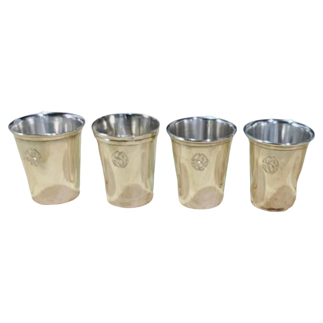 This is a Spaniard Set of Four Silver Shot Glasses. They are engraved with a Monograms of the letters “S” and “O” in the front. Their rim is adorned with ribbed borders. At the base is hallmarked Casa Pomar, 916/1000 (Silver purity).