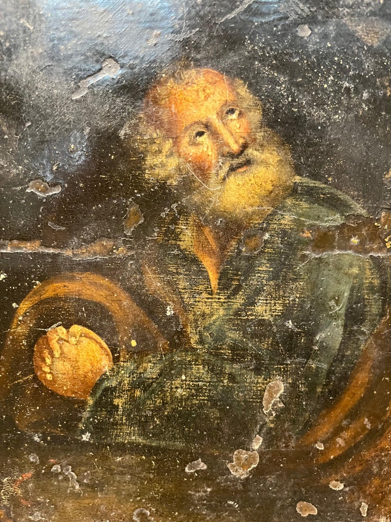 A wonderful 17th century oil on copper painting from the Catalan region of Spain housed in a beautiful frame of painted wood. The painting depicts a saint or a religious man in thoughtful prayer. Fabulous patina.