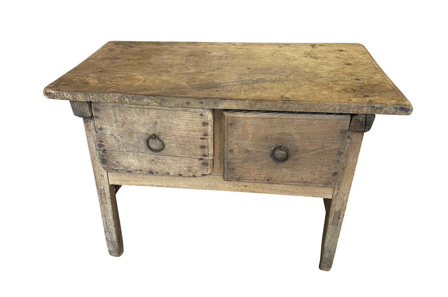 A very handsome 17th century Side Table from the Catalan region of Spain.  Soundly constructed from naturally washed chestnut with 2 drawers.  Clean minimalist lines and wonderful patina.