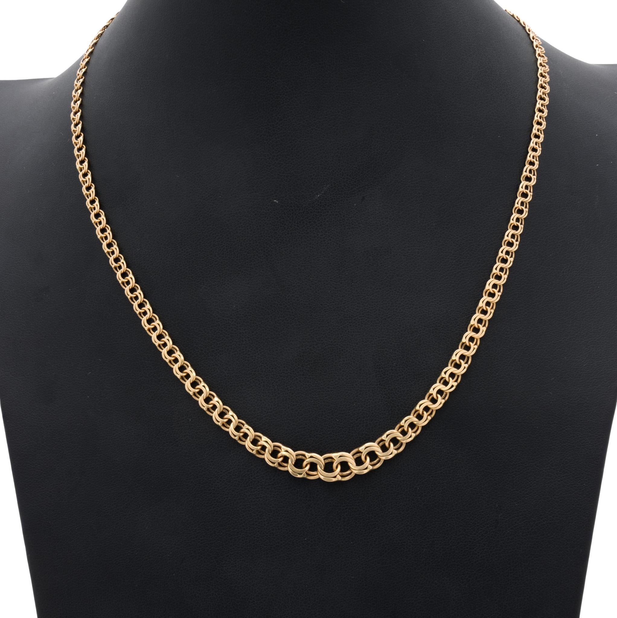 Bismarck Spanish gold link looped chain. Loops are graduated from small links at top to larger links in center. Could be worn alone or with a pendant. Marked 