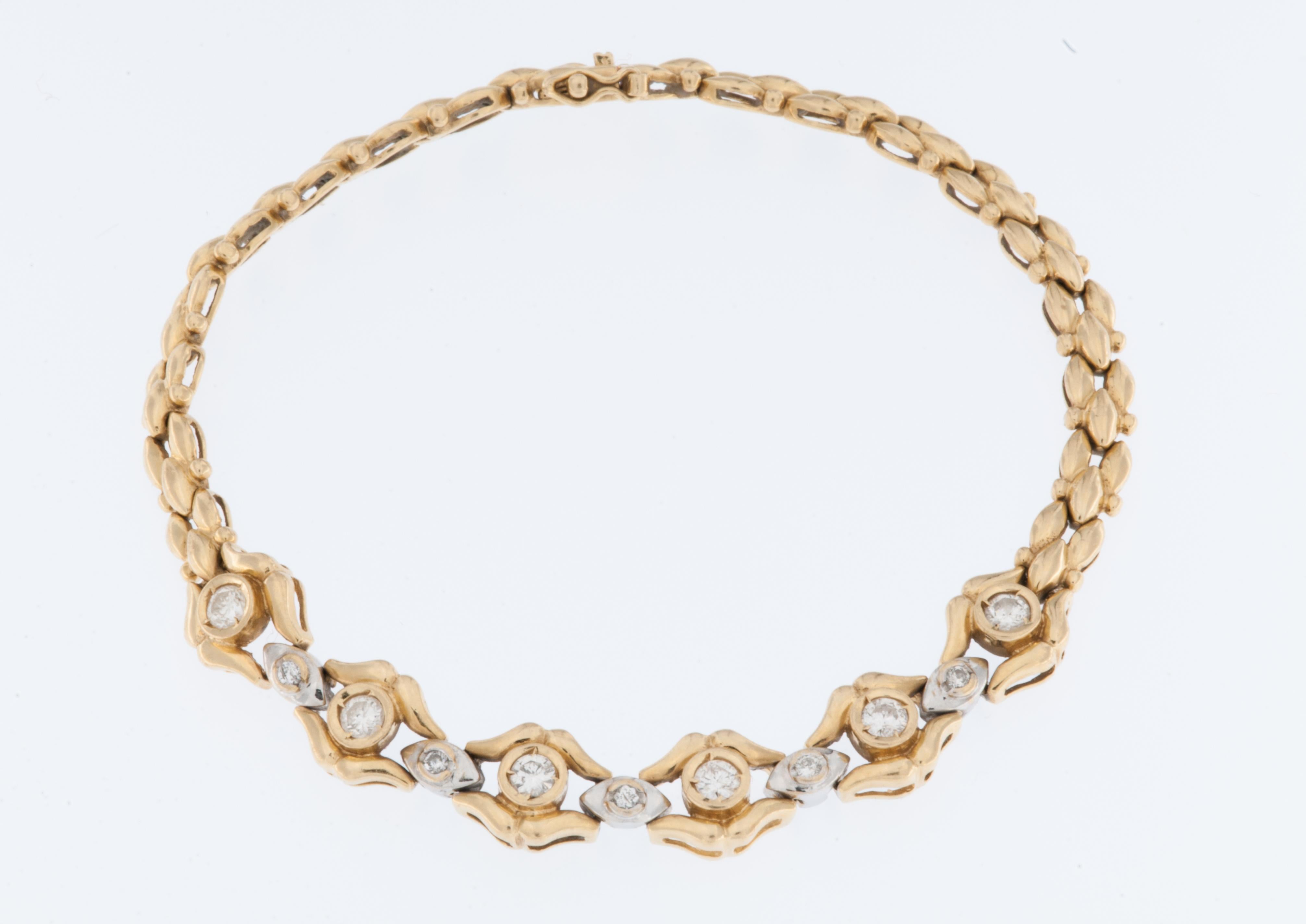 This Spanish 18kt Gold Bracelet with Diamonds is an exquisite piece of jewelry that exudes elegance and sophistication. 

The bracelet is crafted from 18-karat gold, which is renowned for its rich, warm color and durability. This high gold content