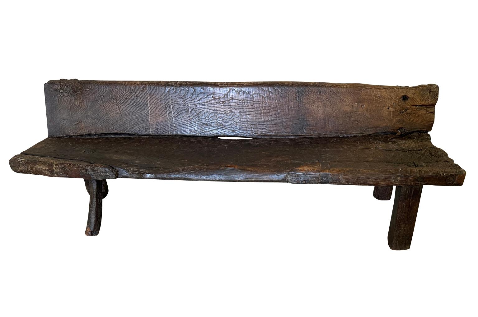 A very handsome 18th century Arte Populaire Bench from the Catalan region of Spain. Beautifully constructed from 2 solid boards of thick pine cut from the same trunk. Wonderful craftsmanship with rich patina. 