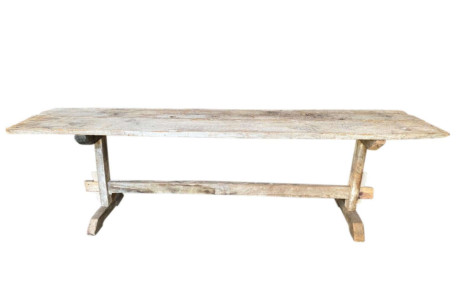 A primitive 18th century console table - trestle table from the Catalan region of Spain.  Soundly constructed from naturally washed pine.  Wonderful patina.  Perfect for a rustic or a modern environment. 