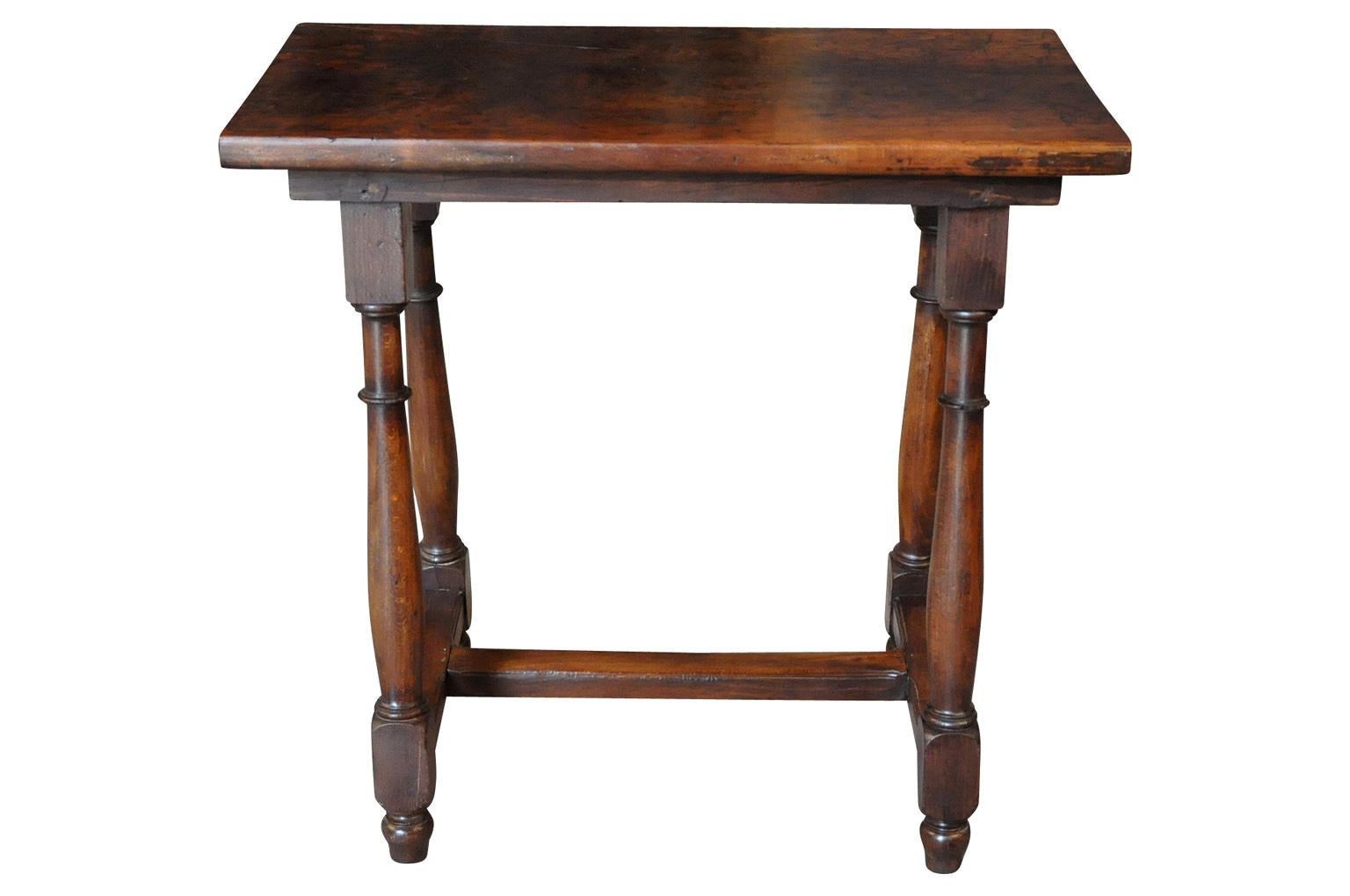 A stunning 18th century diminutive console - side table from the Catalan region of Spain. Wonderfully constructed from walnut with exceptional patina. Solid board top.