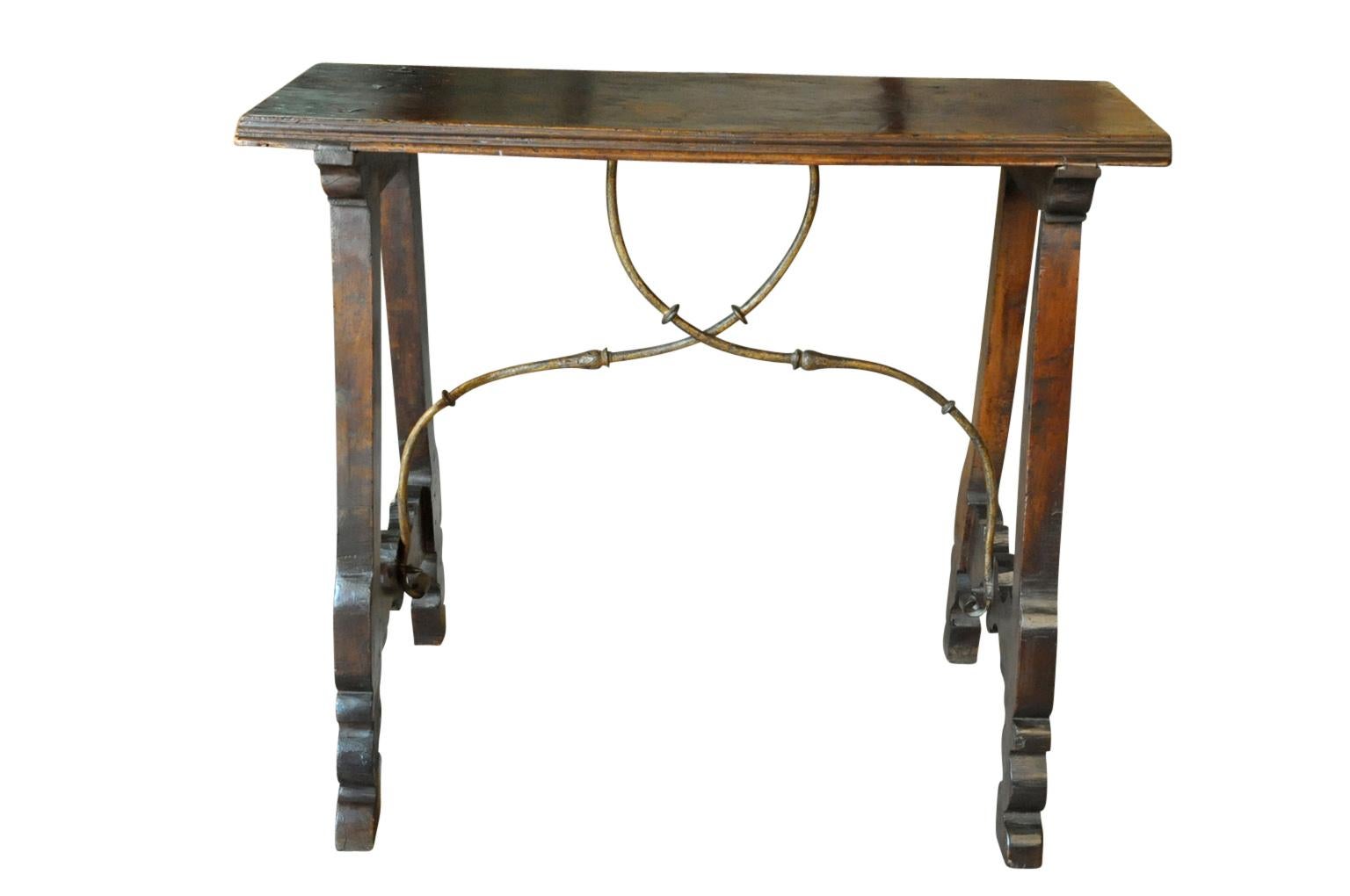 A very handsome 18th century console table from the Catalan region of Spain. Beautifully constructed from walnut and hand forged iron stretchers. A very desirable diminutive size.