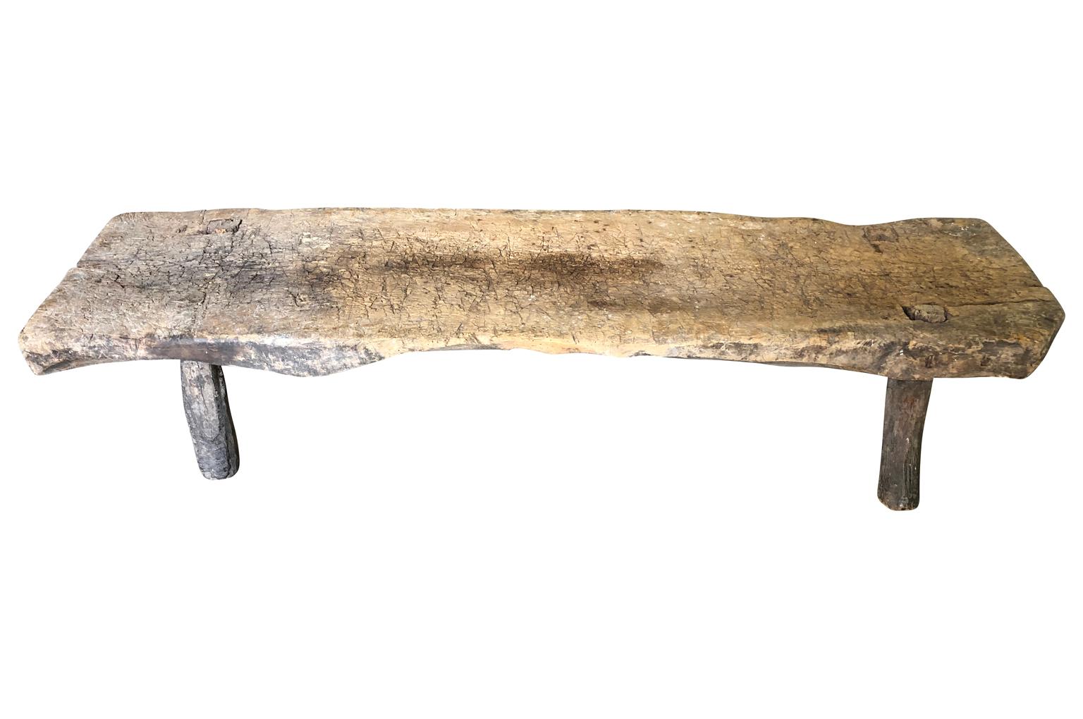 A terrific 18th century primitive bench from the Catalan region of Spain. Soundly constructed from naturally washed oak. Super patina. Wonderful for any rustic interior or exterior.