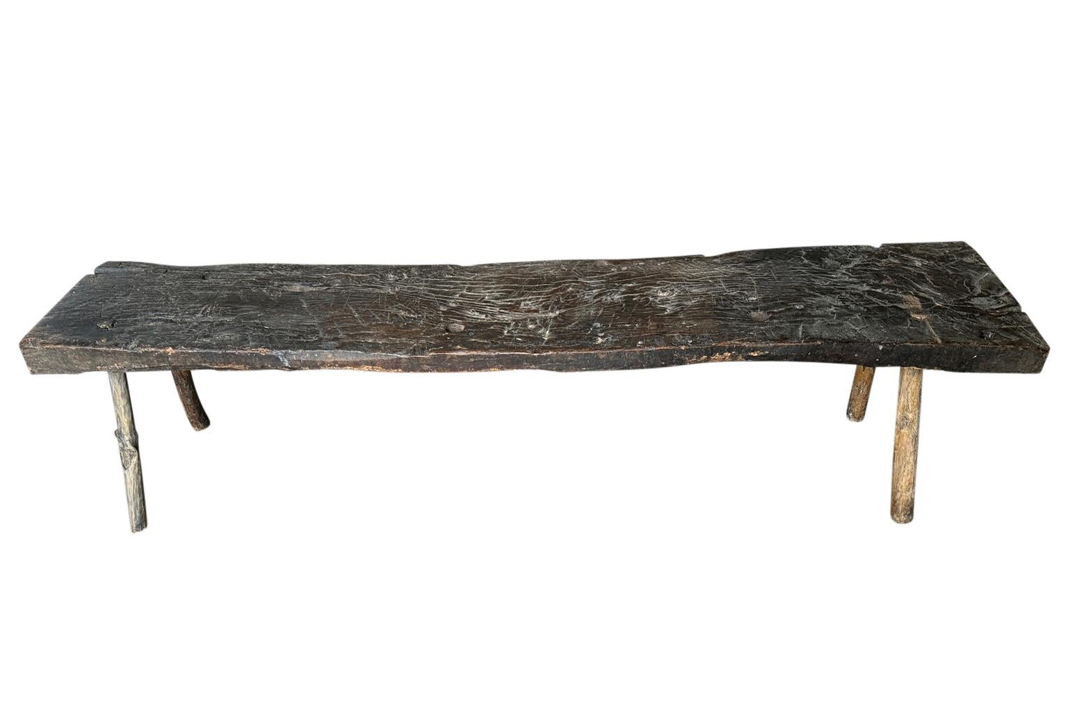 A charming 18th century Bench from the Catalan region of Spain. Soundly constructed from naturally washed chestnut. Super patina. Perfect at the base of a bed, along side of a farm table or as a coffee table. 