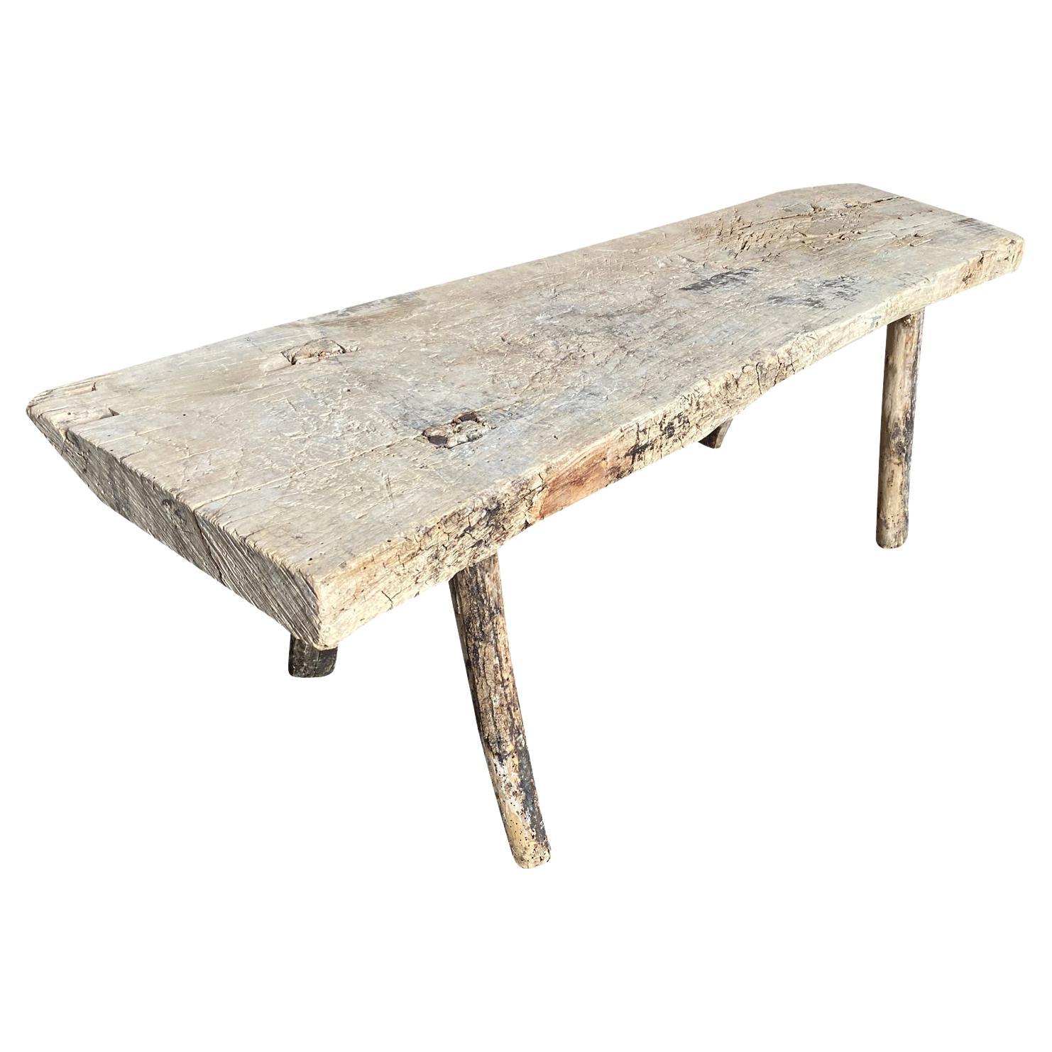A primitive 18th century Bench - Coffee Table from the Catalan region of Spain.  Soundly constructed from naturally washed chestnut with a solid board top and slightly splayed legs.  Super patina and graining.